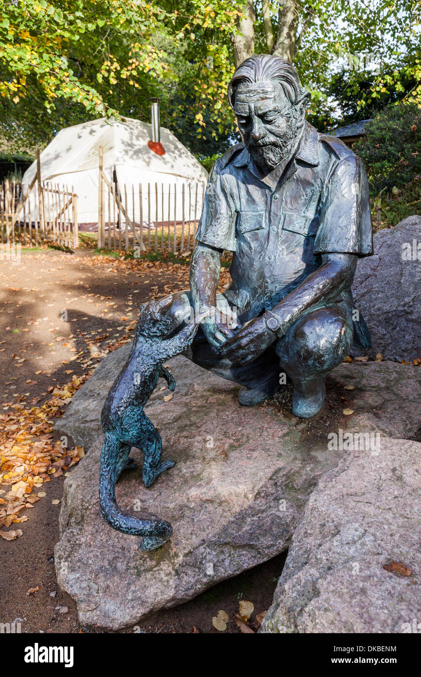 Statue of Gerald Durrell at Durrell Wildlife Park with pod tent in background, Jersey, Channel Islands, UK Stock Photo