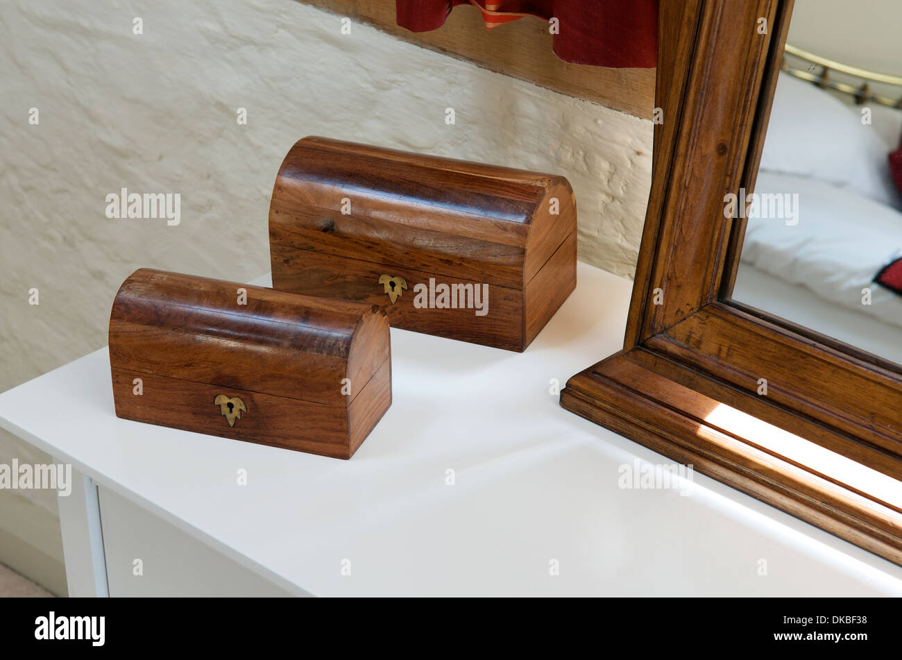 Wooden caskets on a dressing table Stock Photo