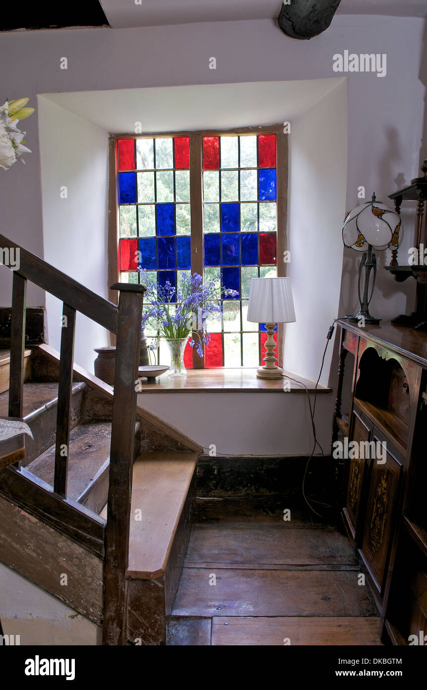 Old fashioned timber landing with stained glass window, Wales UK Stock