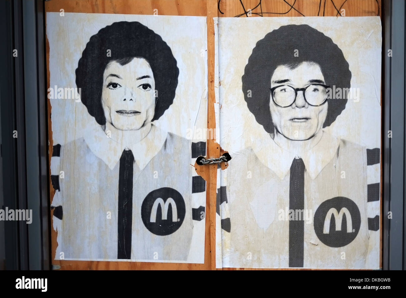 Street art posters despiting Michael Jackson and Andy Warhol as Ronald McDonald on the side of a building in Manhattan, NYC. Stock Photo