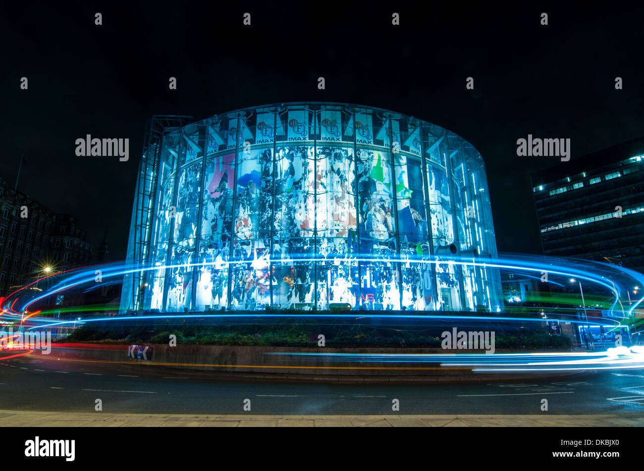 Waterloo Bridge, London, UK - traffic passes by the IMAX cinema at night Stock Photo