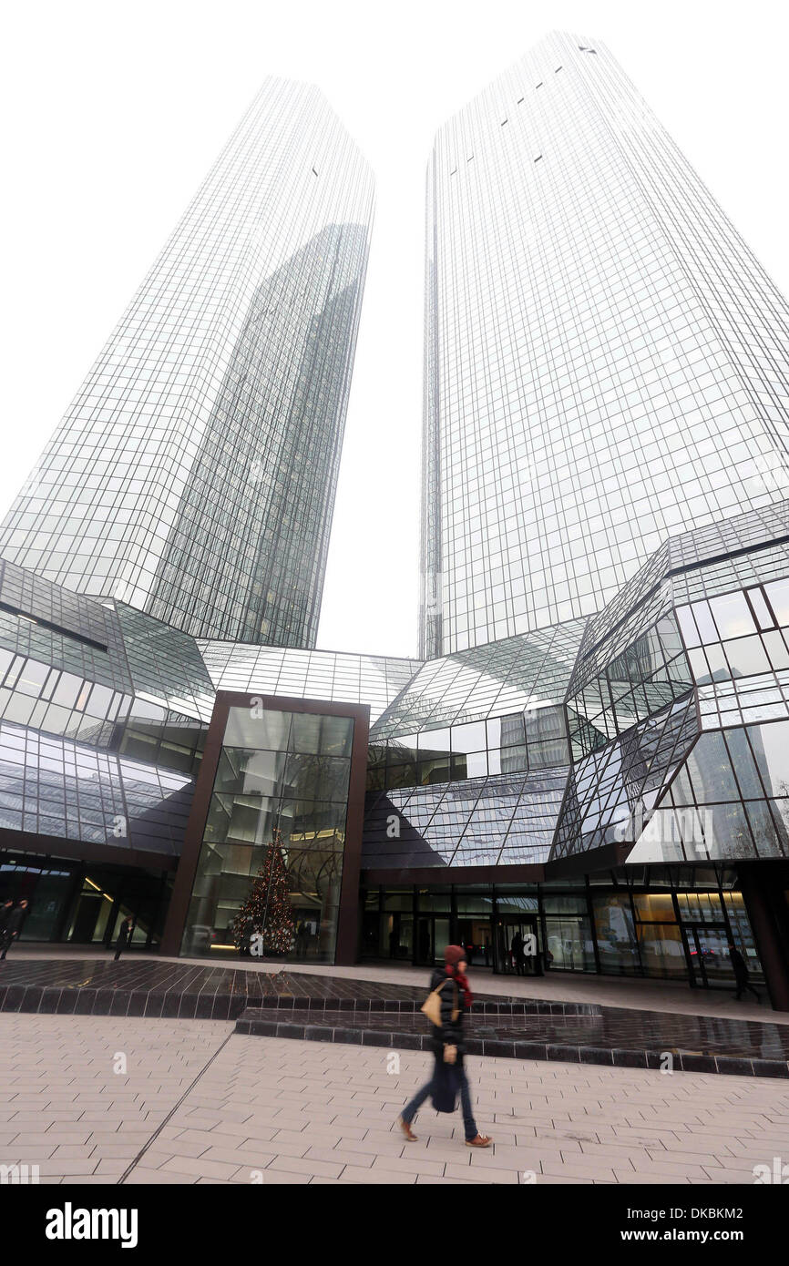 Frankfurt, Germany. 4th Dec, 2013. A woman walks in front of the Deutsche Bank headquarters in Frankfurt, Germany, Dec. 4, 2012. Germany's biggest bank Deutsche Bank on Wednesday said it had taken measures to prevent misconduct after the European Union (EU) fined it for rigging interest rates. © Luo Huanhuan/Xinhua/Alamy Live News Stock Photo