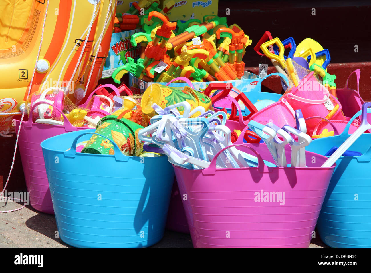 Buckets and spades on sale at the seaside Stock Photo Alamy
