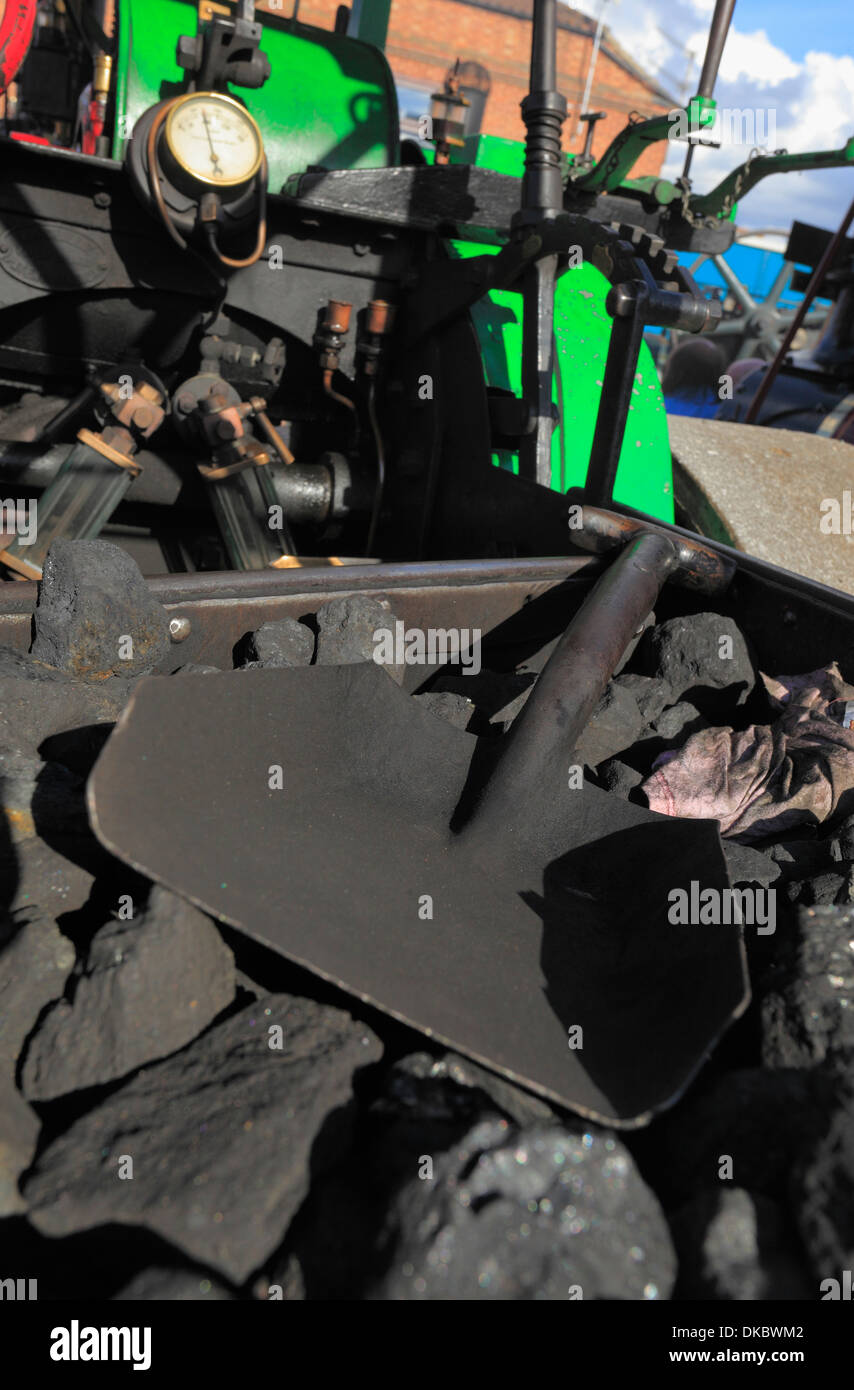 Coal and a shovel at the back of a traction engine at a steam rally. Stock Photo