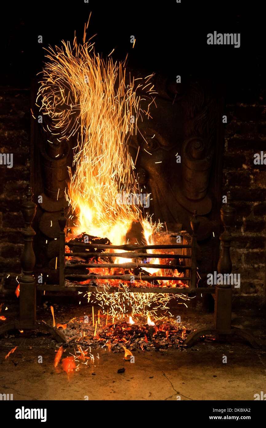 Fireplace with fire sparking Stock Photo