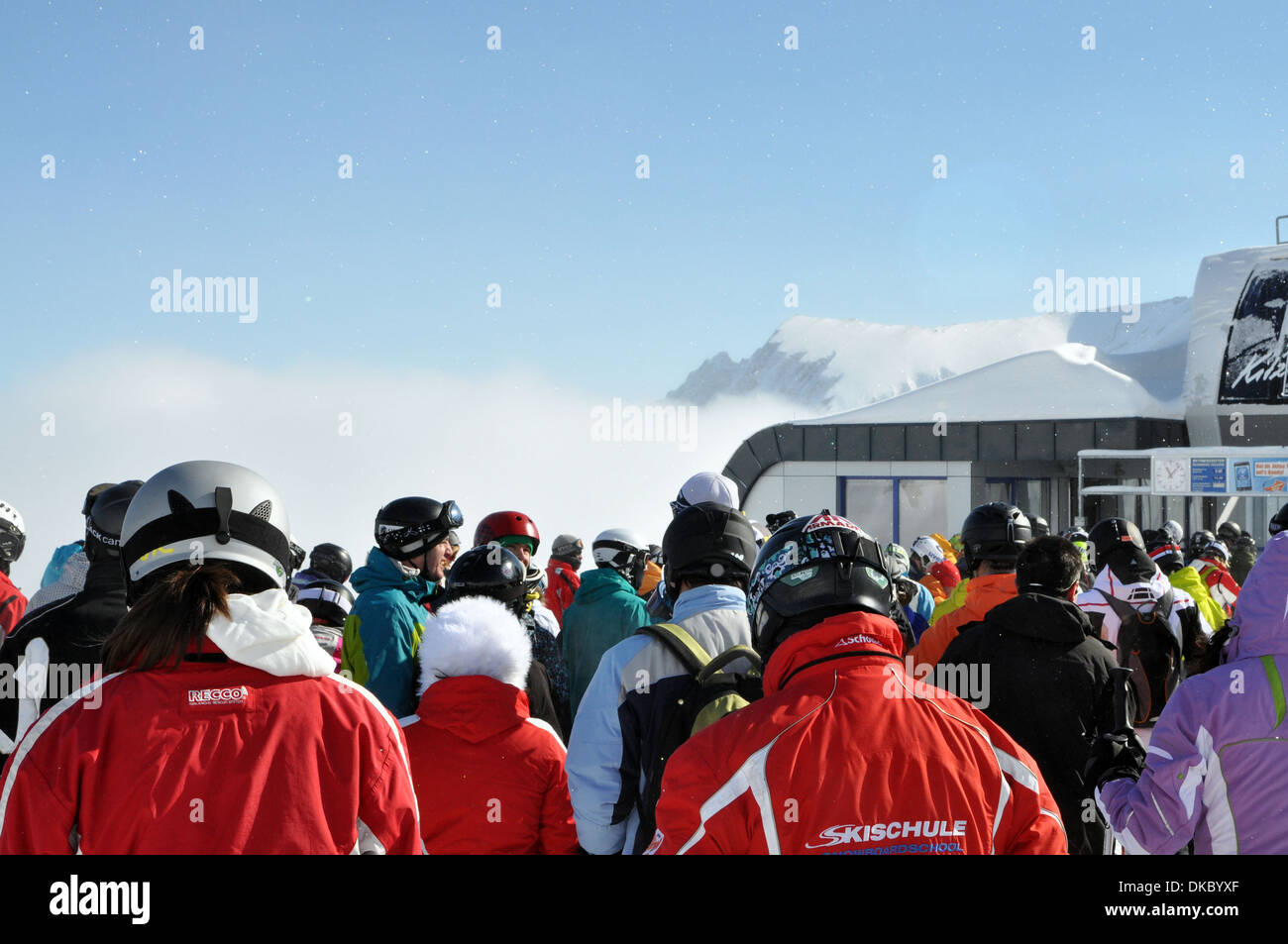 Crowds wait in the chair-lift queue Zell am See, Austria Stock Photo