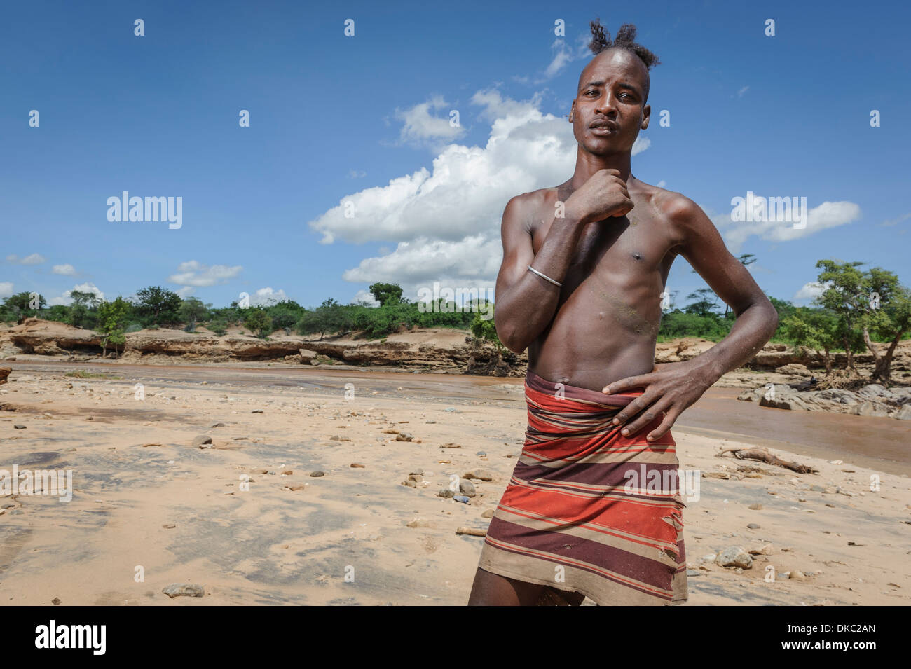 Young man about to become a man. After finishing his bull jumping ceremony he'll become officially a man withing his tribe. Hamer, Omo valley, Ethiopia Stock Photo