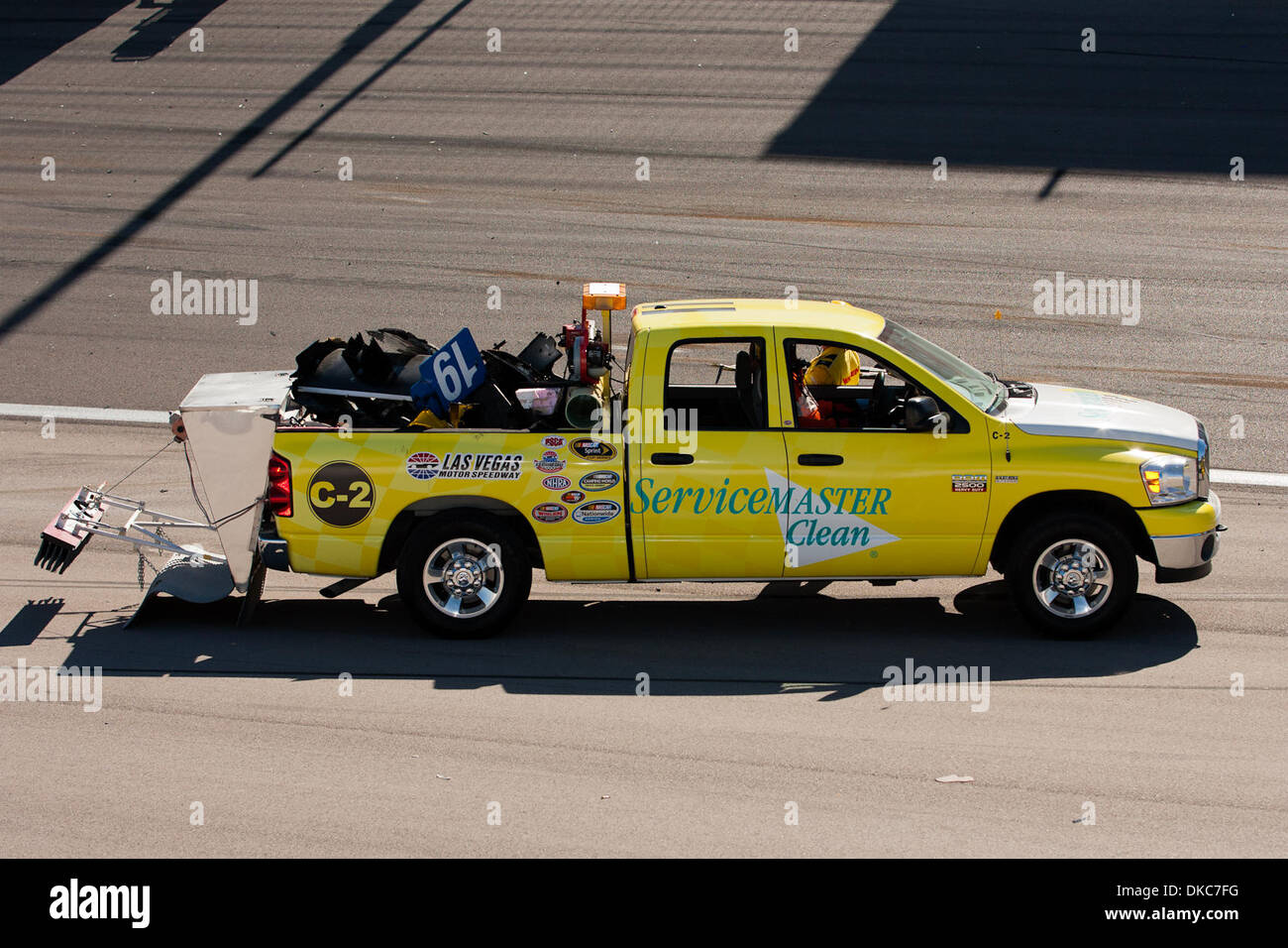 Oct. 16, 2011 - Las Vegas, Nevada, U.S - The safety crew works on removing  the parts that were strewn all over the race track after a lap 13 crash  caused a