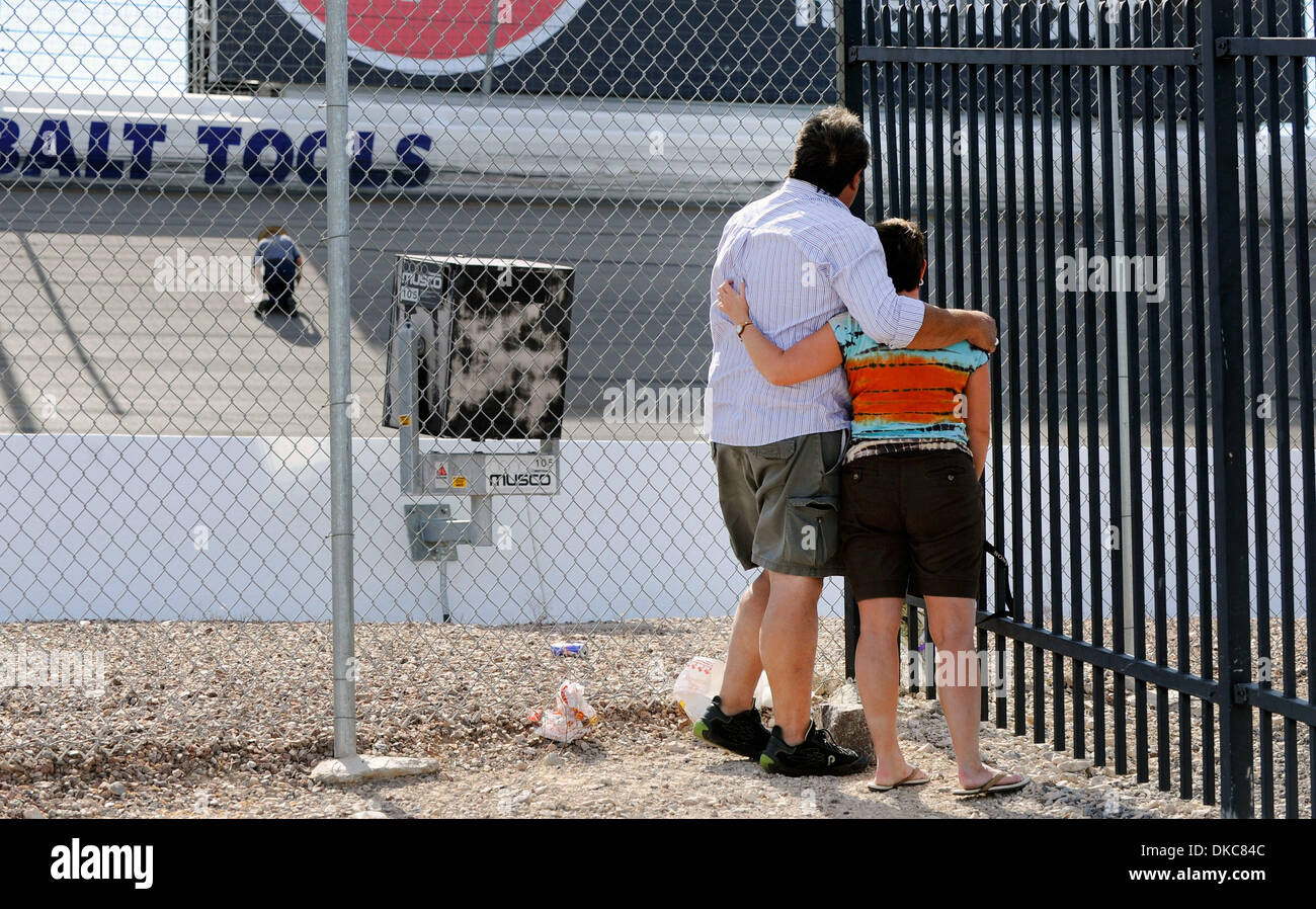 Oct. 17, 2011 - Las Vegas, Nevada, USA -  Bill Van Divner (L) and Jenn Yuhas spend a moment near the crash site at the Las Vegas Motor Speedway on Monday, Oct. 17, 2011. Dan Wheldon, driver of the #77 Dallara Honda, was killed during the Las Vegas Indy 300 part of the IZOD IndyCar World Championships presented by Honda at Las Vegas Motor Speedway on October 16, 2011 in Las Vegas. Y Stock Photo