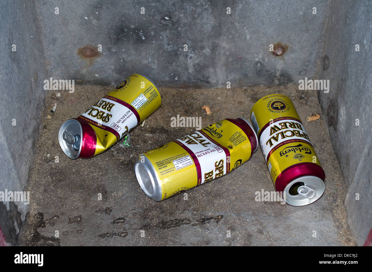 Emprty strong beer lager cans thrown in rubbish litter bins Stock Photo