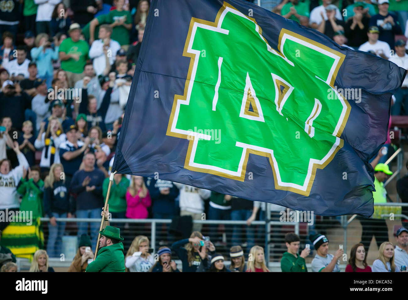 Palo Alto, CA, . 30th Nov, 2013. The Notre Dame flag and mascot take the field prior to the NCAA Football game between the Stanford Cardinal and the Notre Dame Fighting Irish at Stanford Stadium in Palo Alto, CA. Stanford defeated Notre Dame 27-20. Damon Tarver/Cal Sport Media/Alamy Live News Stock Photo