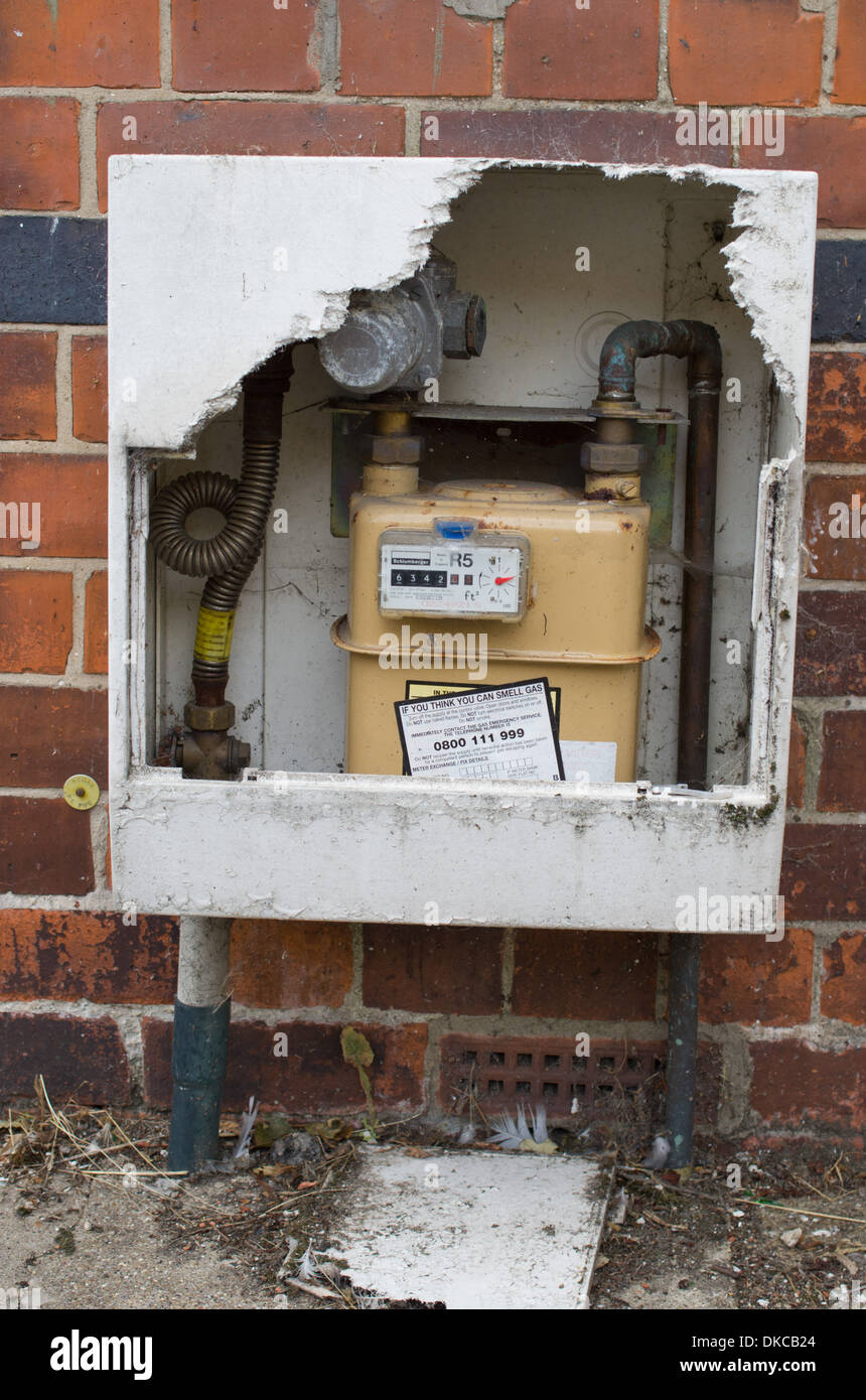 Fibreglass housing of gas meter broken exposing meter Stock Photo Alamy