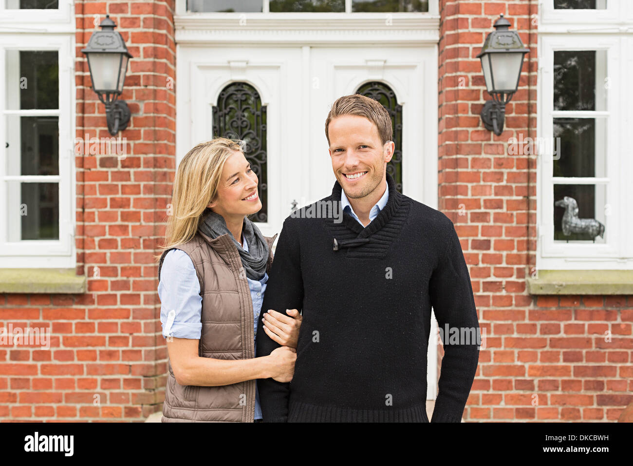 Mid adult couple outside house Stock Photo