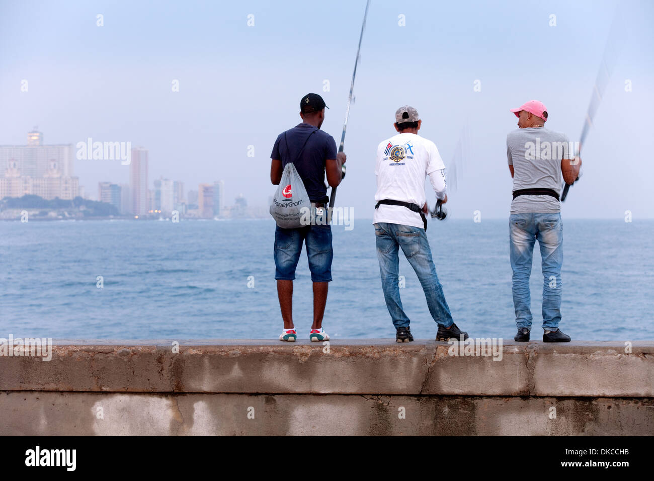 Havana, Cuba, Fisherman fishing at dawn, the Malecon, Havana, Caribbean Stock Photo