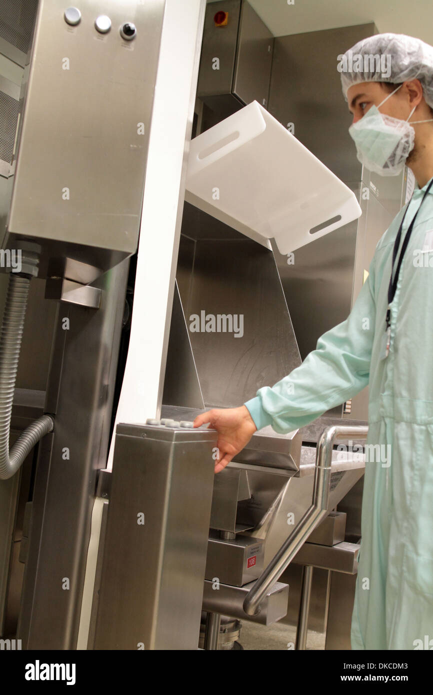 A technical person working on a pharmaceutical product unit Stock Photo