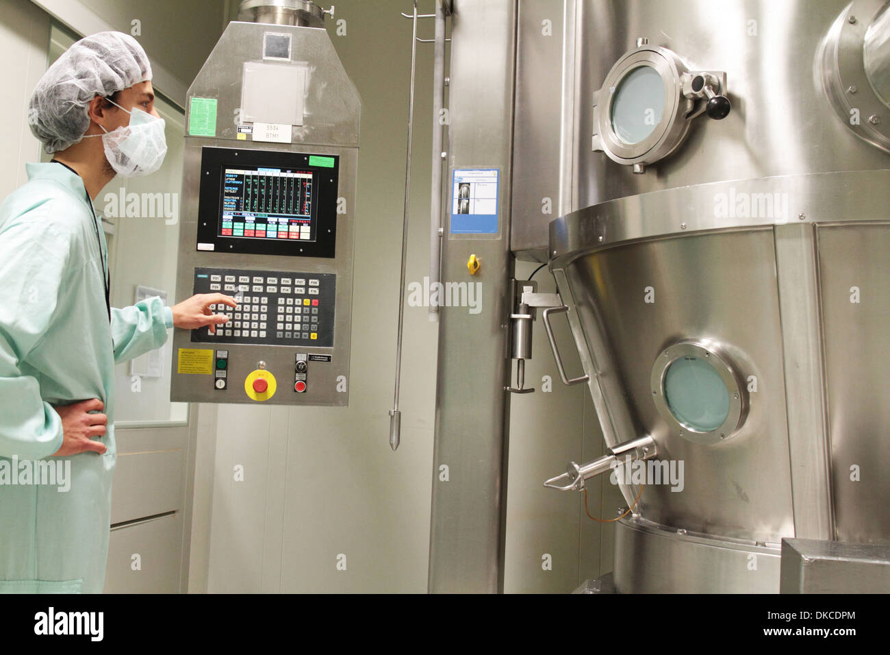 A technical person working on a pharmaceutical product unit Stock Photo