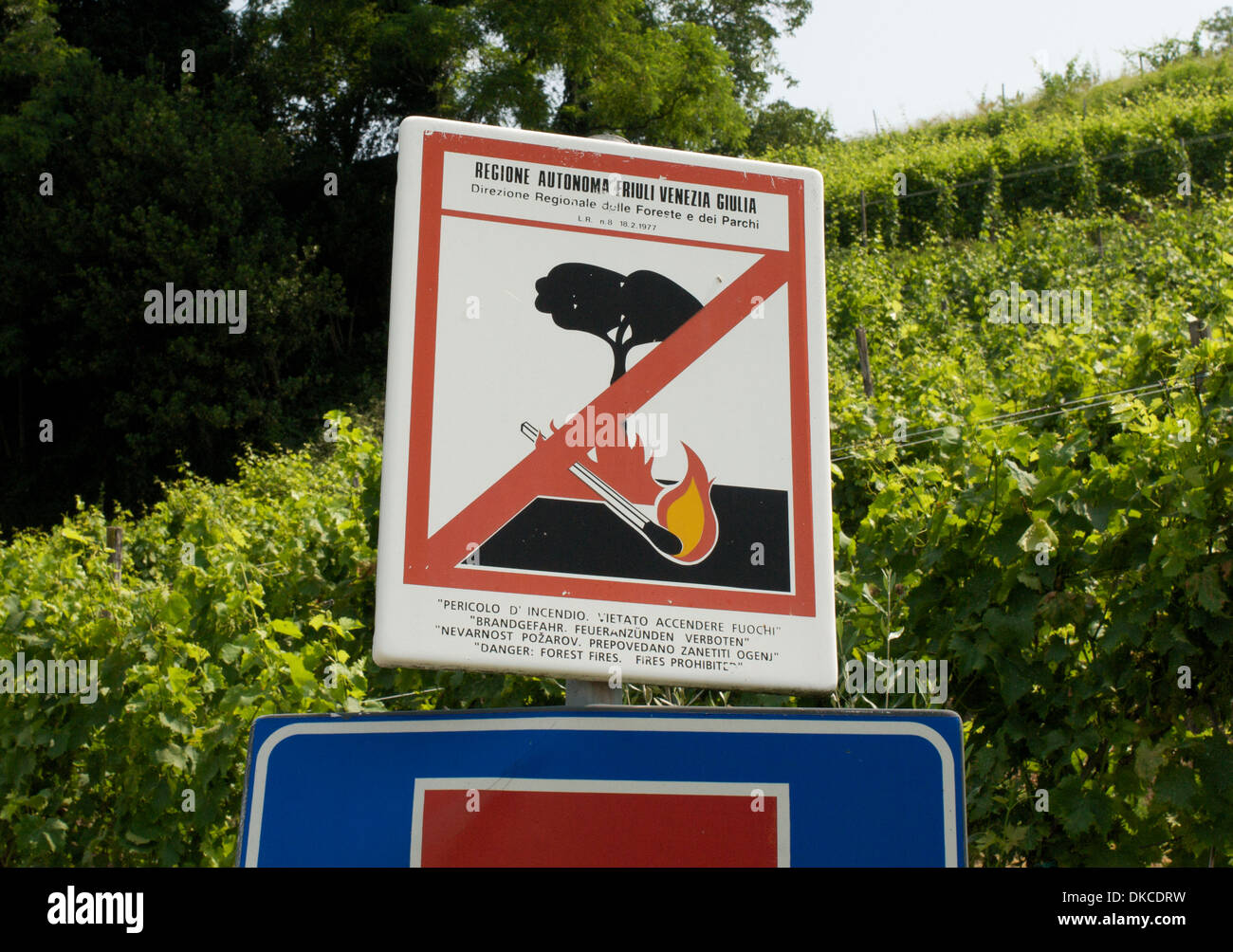 Forest fire warning sign in Italian, English, German and Slovene on the outskirts of Cormons, Italy Stock Photo