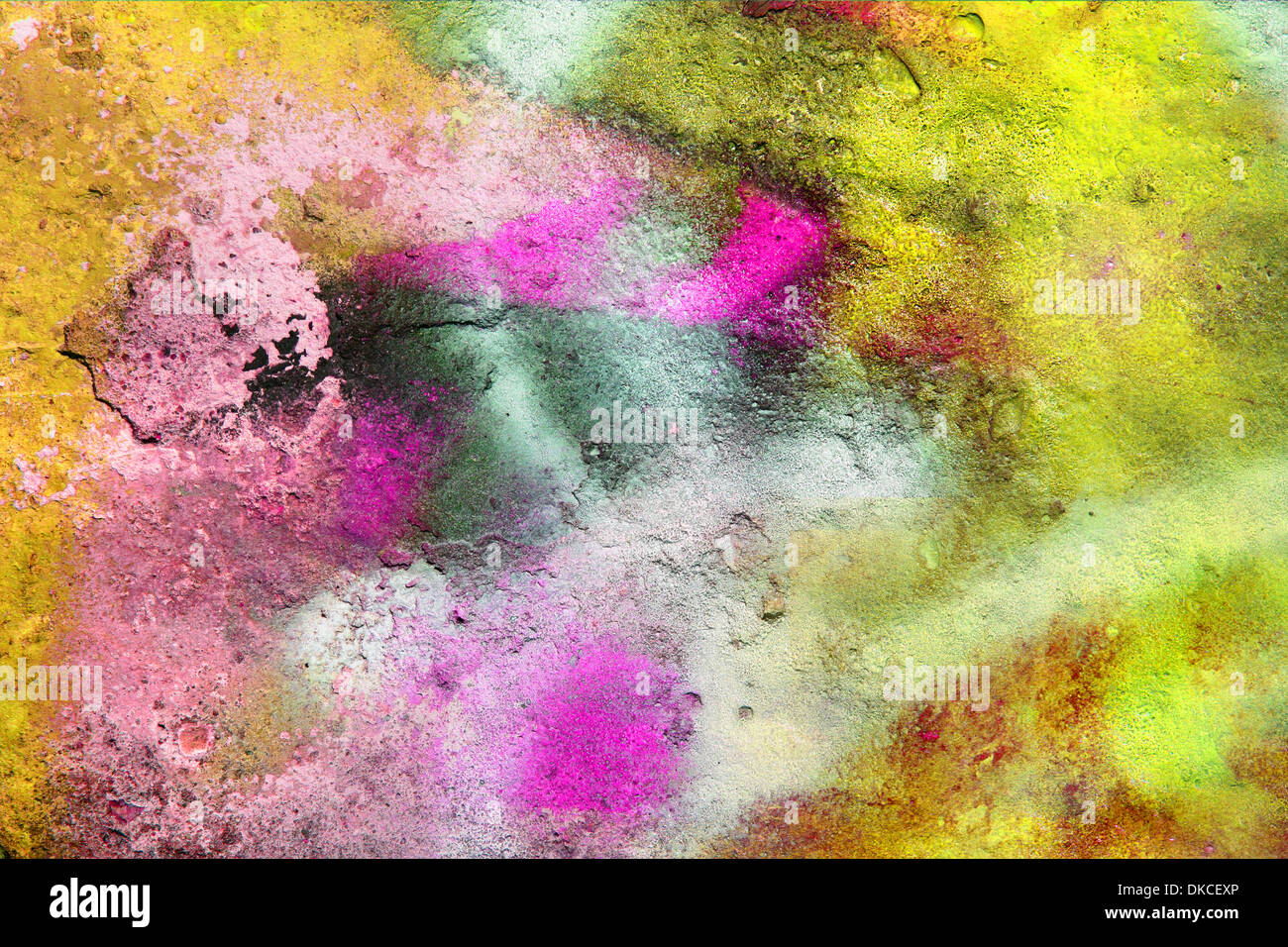 Grunge background / texture on a purple, orange and yellow wall with