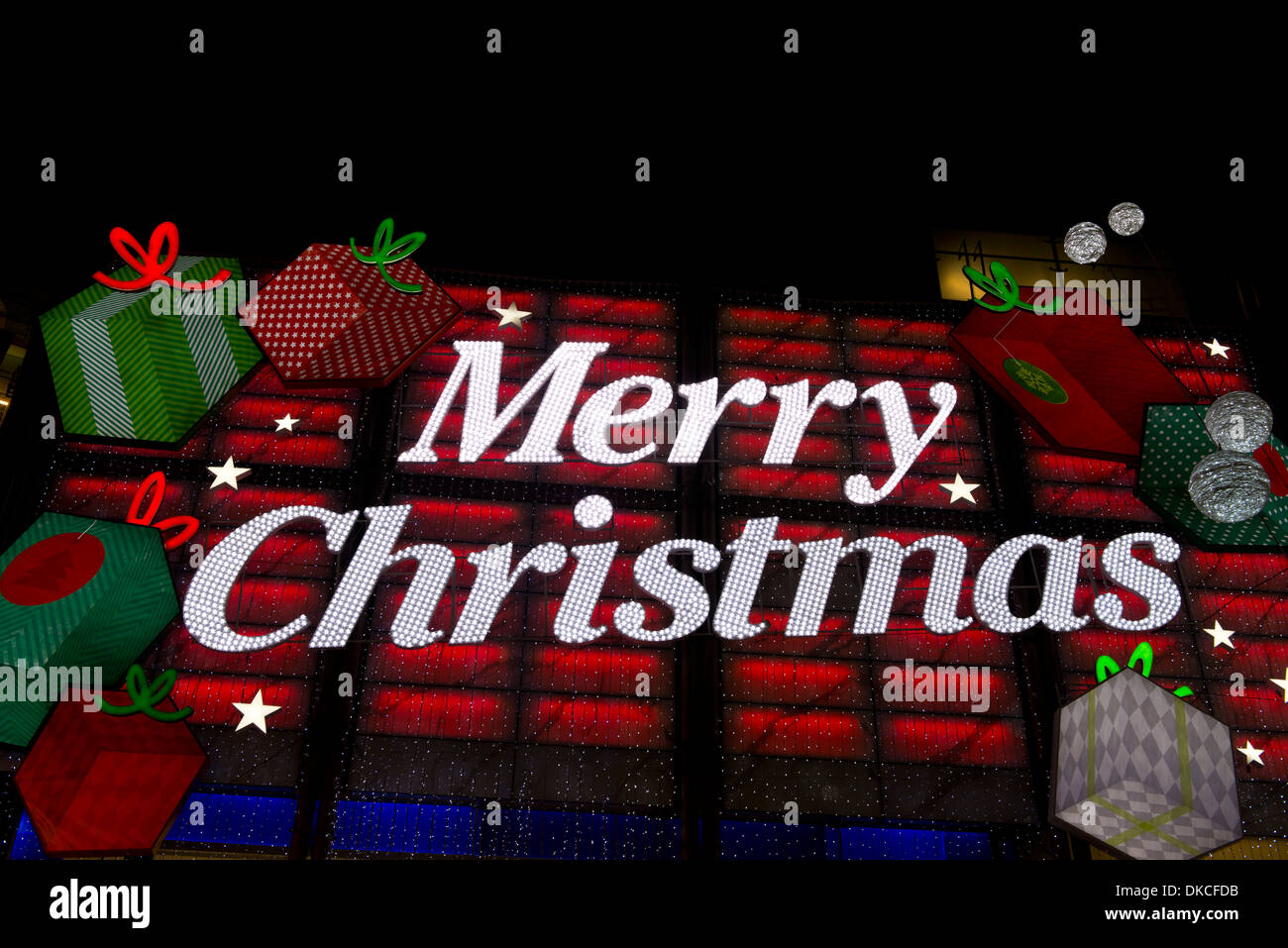 Illuminated Merry Christmas electric sign in shop, London Stock Photo