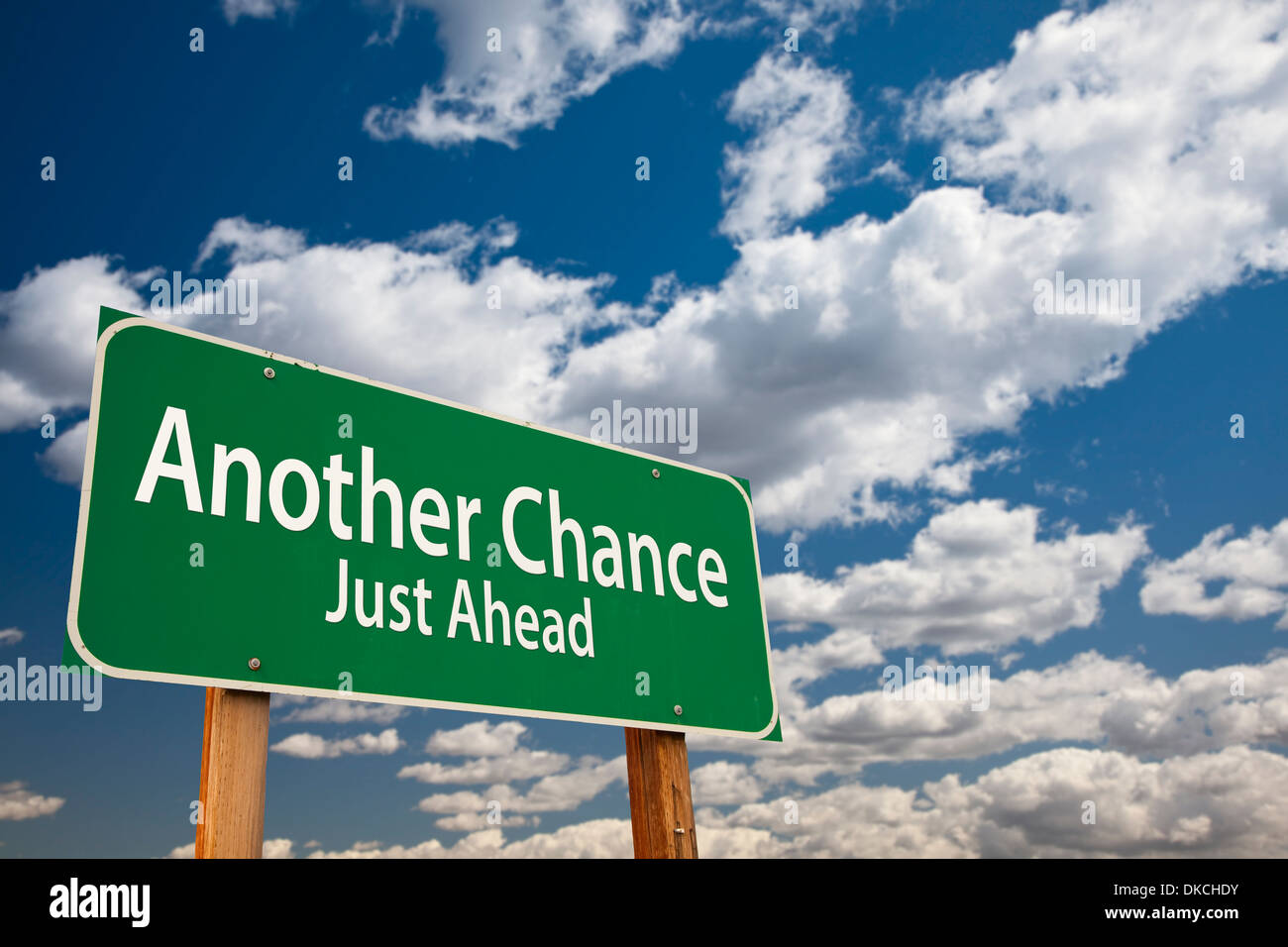 Another Chance Just Ahead Green Road Sign Over Dramatic Clouds and Sky. Stock Photo
