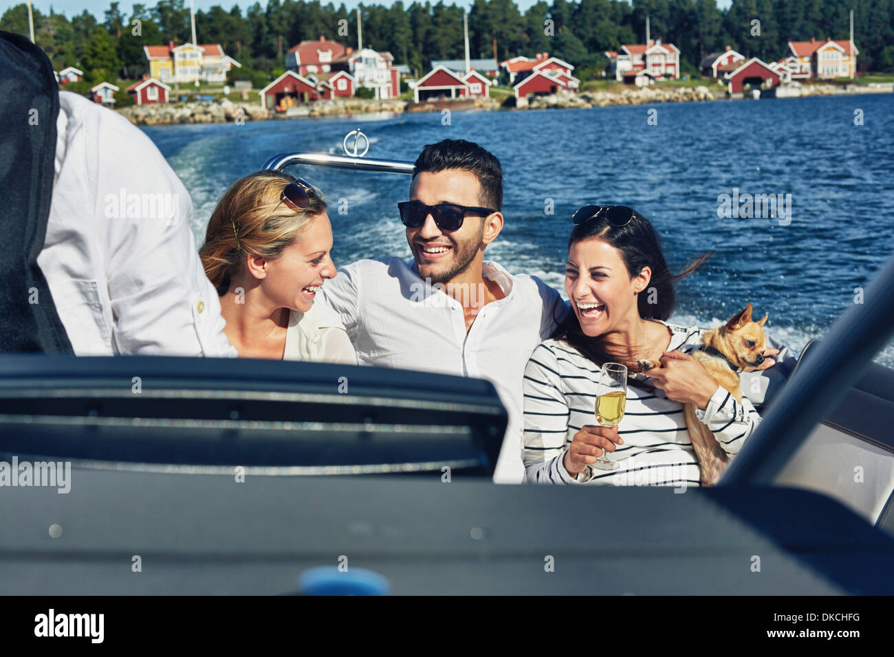 Young adults on boat, Gavle, Sweden Stock Photo