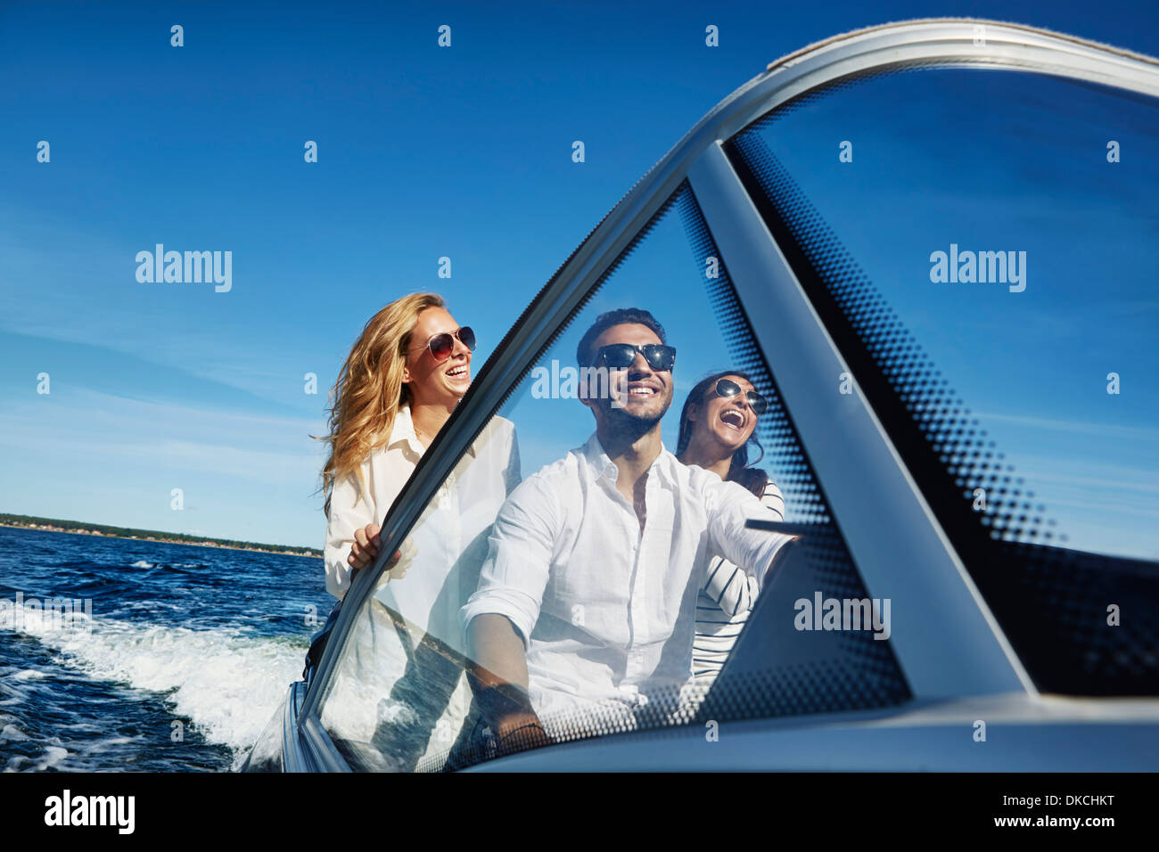 Young adults on boat, Gavle, Sweden Stock Photo