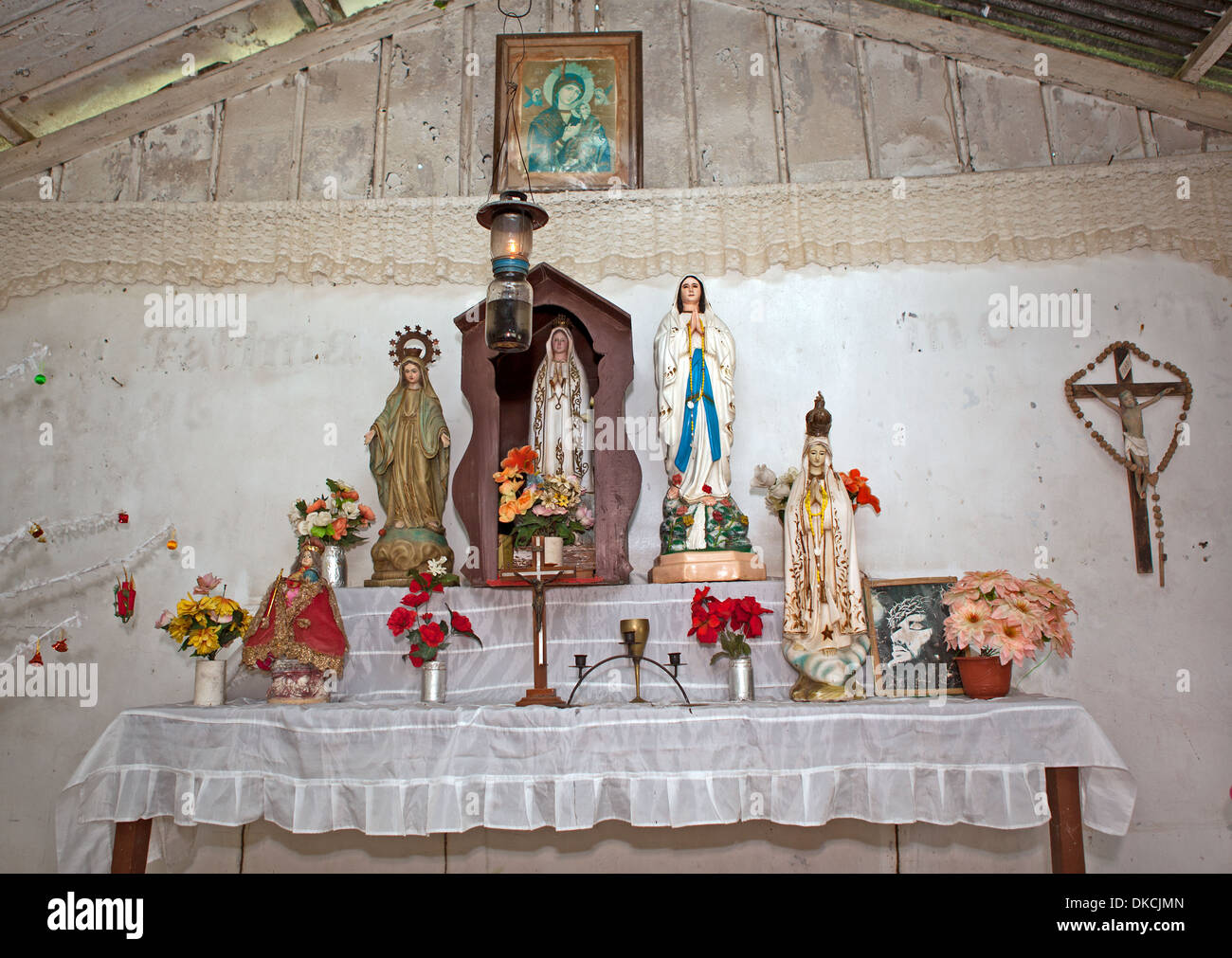 Alter of a Catholic church in a remote village on Luzon Island, Philippines. Stock Photo
