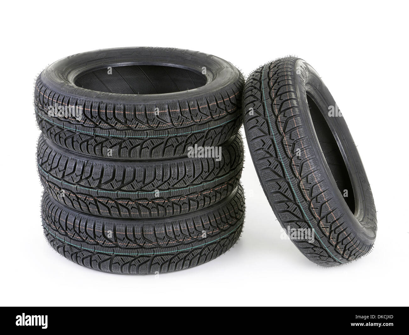 Set of four winter car tyres shot on white Stock Photo
