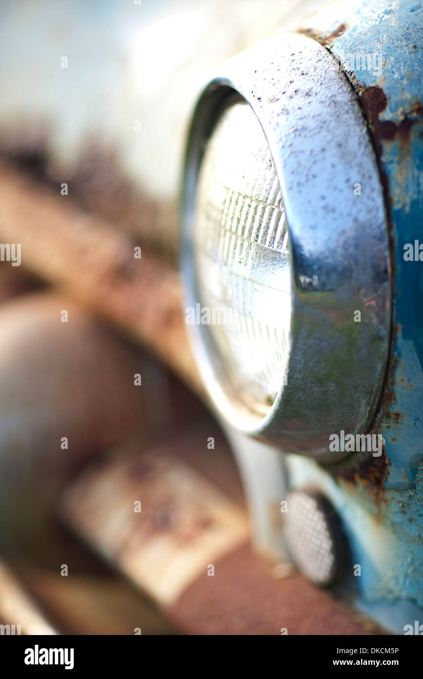 Side view of rusty car headlight and bumper Stock Photo