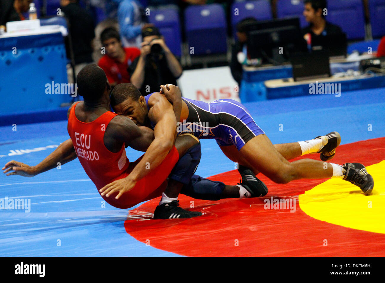 Oct. 24, 2011 - Guadalajara, Mexico - JORDAN BURROUGHS (blue) of the United States plows against JOSE MERCADO of Ecuador during the men's 74 kilogram  freestyle wrestling quarterfinals at the 2011 Pan American Games. Burroughts, a two-time NCAA title winner for the University of Nebraska, went on to win the gold medal against Yunierki Blanco of Cuba. (Credit Image: © Jeremy Brening Stock Photo