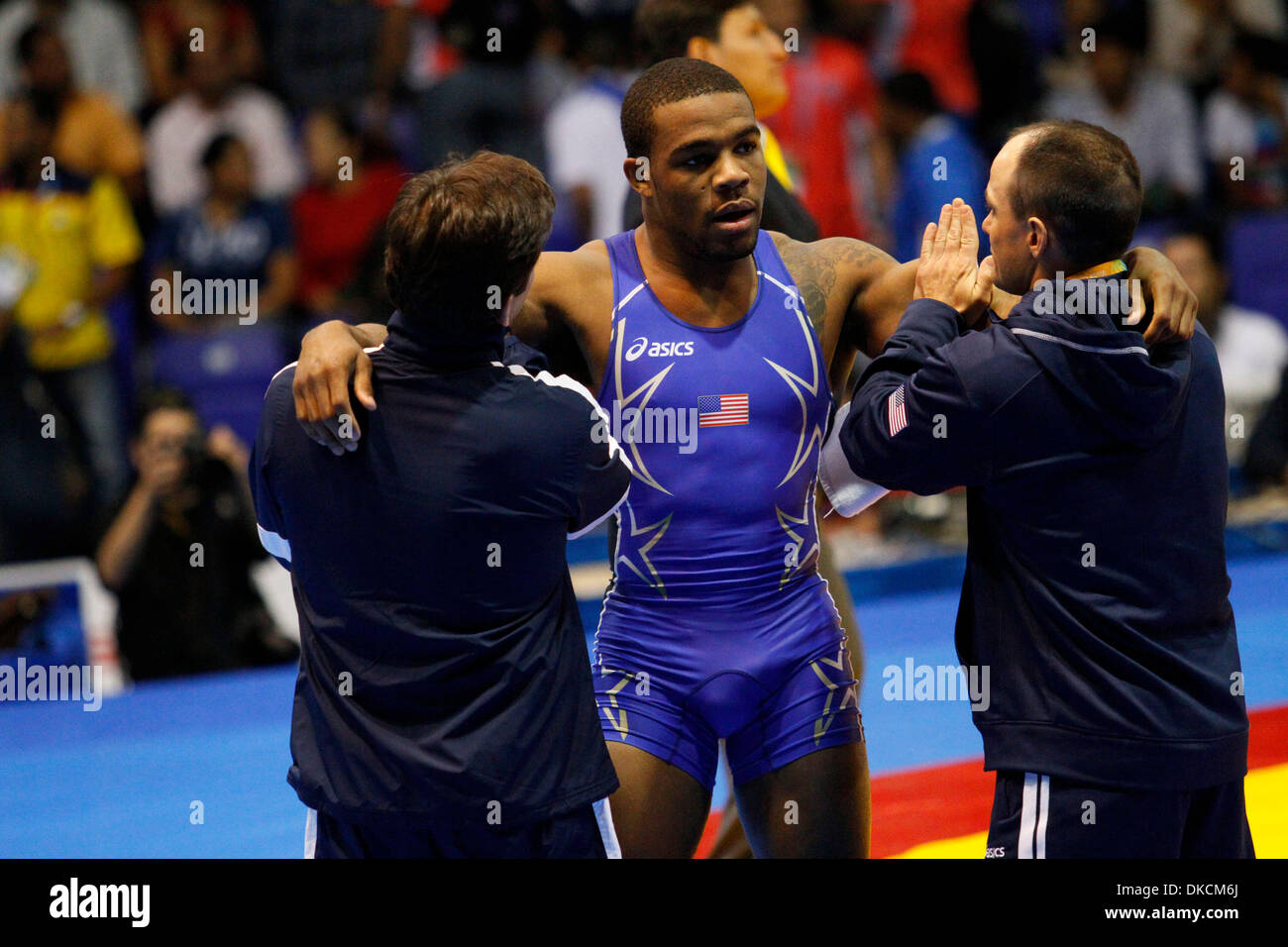 Oct. 24, 2011 - Guadalajara, Mexico - JORDAN BURROUGHS of the United States is loosened up by coaches during a break in his match against J. Mercado of Ecuador in the men's 74 kilogram  freestyle wrestling quarterfinals at the 2011 Pan American Games. Burroughts, a two-time NCAA title winner for the University of Nebraska, went on to win the gold medal against Yunierki Blanco of Cu Stock Photo