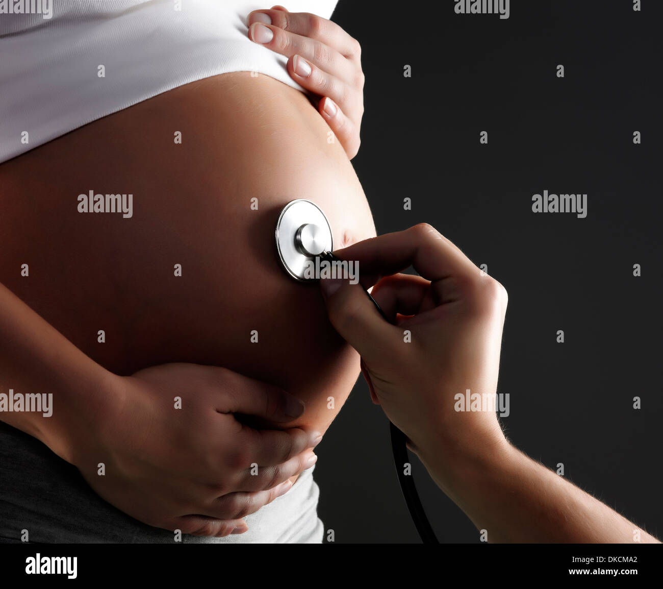 Stethoscope on pregnant woman's belly Stock Photo Alamy
