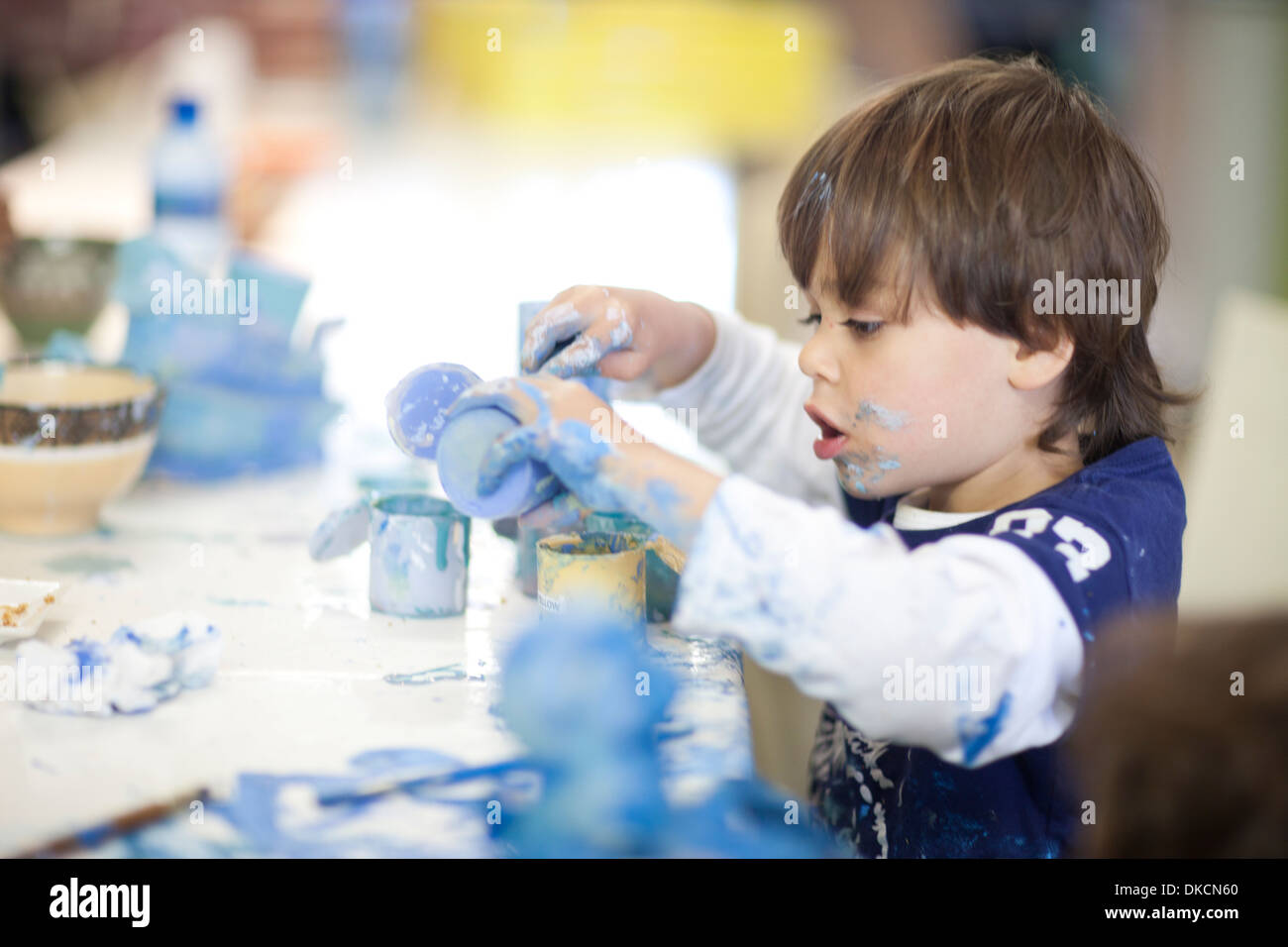 Toddler concentrating in art class Stock Photo