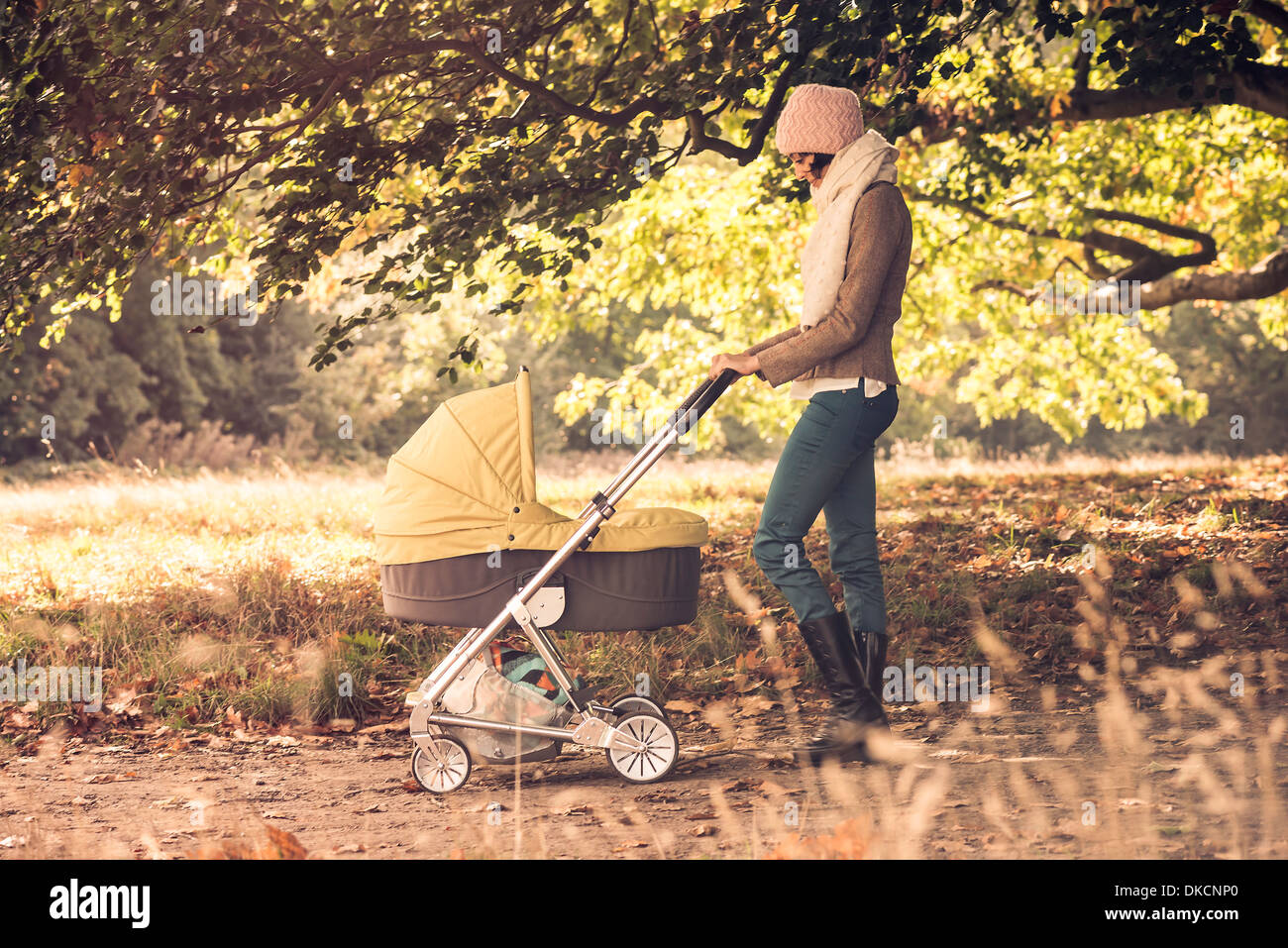 Mother and baby pram park walking hires stock photography and images