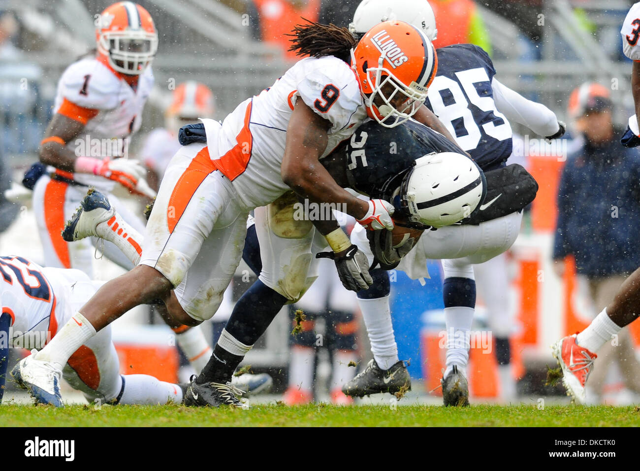 Oct. 29, 2011 - State College, Pennsylvania, United States of America - Penn State running back Silas Redd (25) is tackled by Illinois defender Trulon Henry (9) during a Big 10 matchup at Happy Valley.  Penn State and Illinois are scoreless at the half. (Credit Image: © Brian Freed/Southcreek/ZUMAPRESS.com) Stock Photo