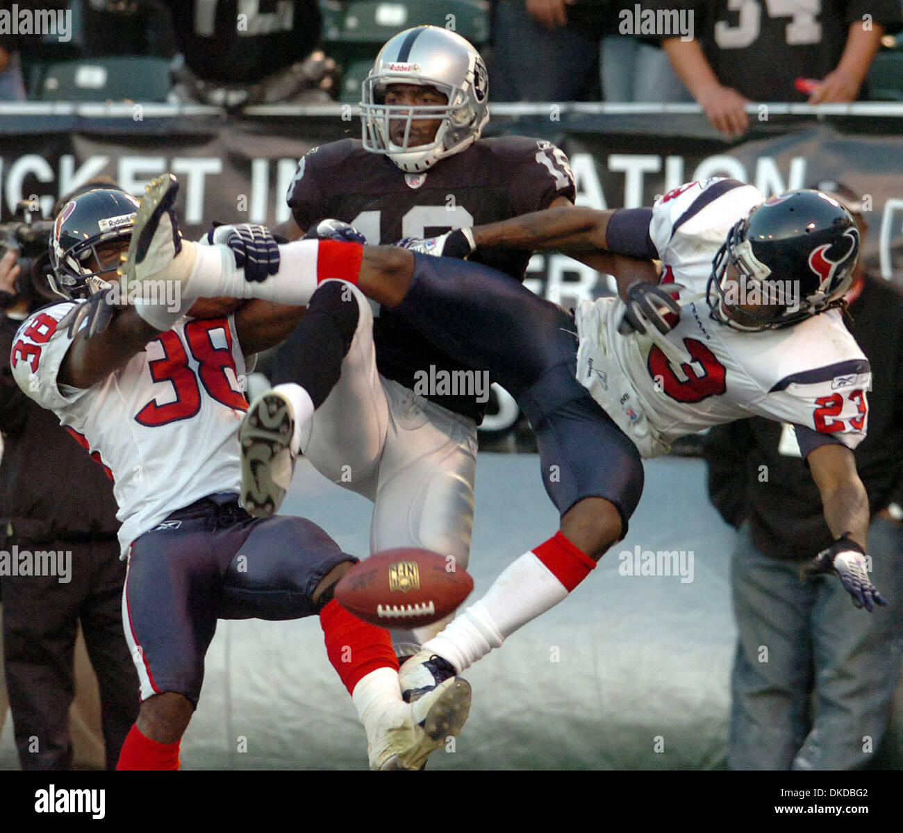 Dec 03, 2006; Oakland, CA, USA; Oakland Raiders wide receiver RANDY MOSS can't catch a pass in the endzone sandwiched by Houston Texans cornerbacks DEMARCUS FAGGINS (38) and DUNTA ROBINSON (23) with less than a minute to go in the fourth quarter in game played at the McAfee Coliseum. The Texans beat the Raiders 23-14. Mandatory Credit: Photo by Eddie Ledesma/Contra Costa Times/ZUMA Stock Photo