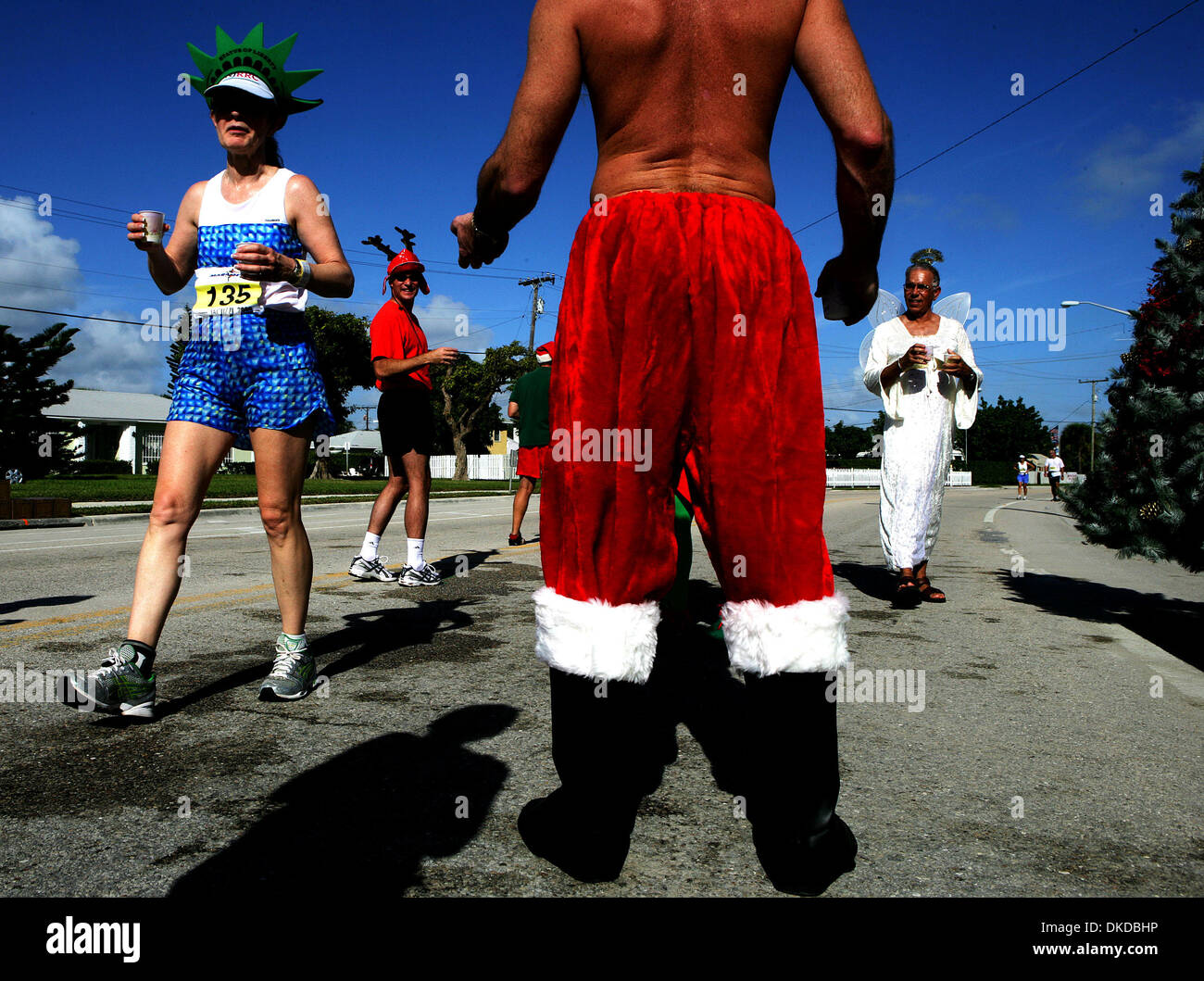 Dec 03, 2006; West Palm Beach, FL, USA; Diana Burton of Middletown, New  Jersey grabs a water from the Northboro Park water station during Sunday's  Marathon of The Palm Beaches. Northboro had