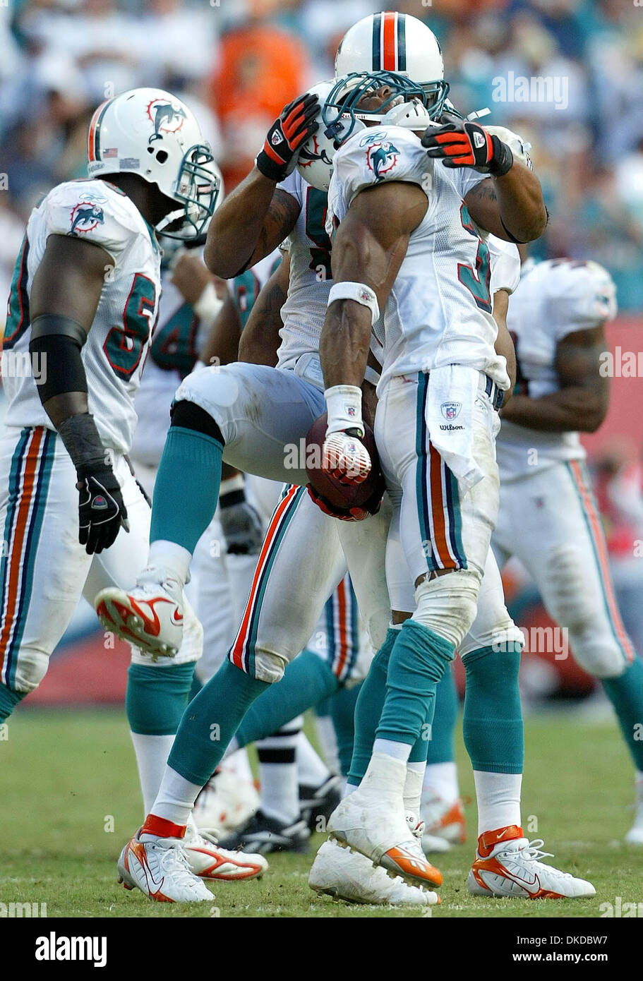 Dec 10, 2006; Miami Gardens, FL, USA; Miami Dolphins safety Yeremiah Bell  celebrates with teammate Channing Crowder after recovering a fumble, during  first half action Sunday afternoon at Dolphin stadium. Dolphins 21-0