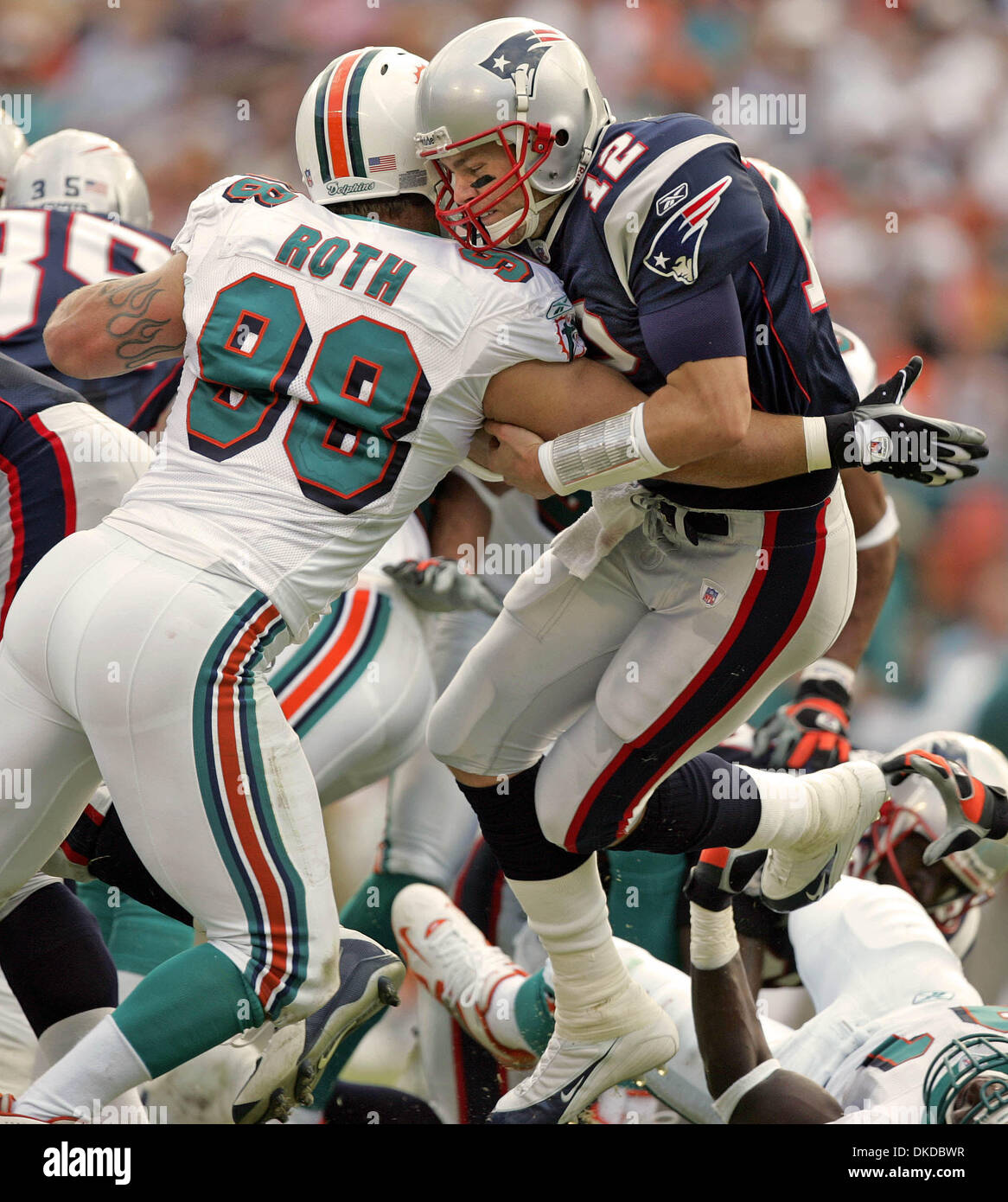 Dec 10, 2006; Miami Gardens, FL, USA; Miami Dolphins running back Sammy  Morris runs by the Patriots Mike Vrabel during fourth quarter action Sunday  afternoon at Dolphin stadium. Dolphins 21-0 over the