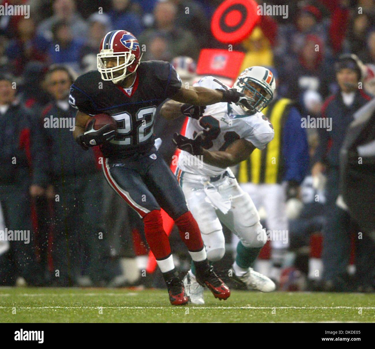 Dec 17, 2006; Orchard Park, FL, USA; After intercepting pass, Bills defender NATE CLEMENTS looks to break away from Dolphins running back SAMMY MORRIS for more running room.   Mandatory Credit: Photo by Damon Higgins/Palm Beach Post/ZUMA Press. (©) Copyright 2006 by Palm Beach Post Stock Photo