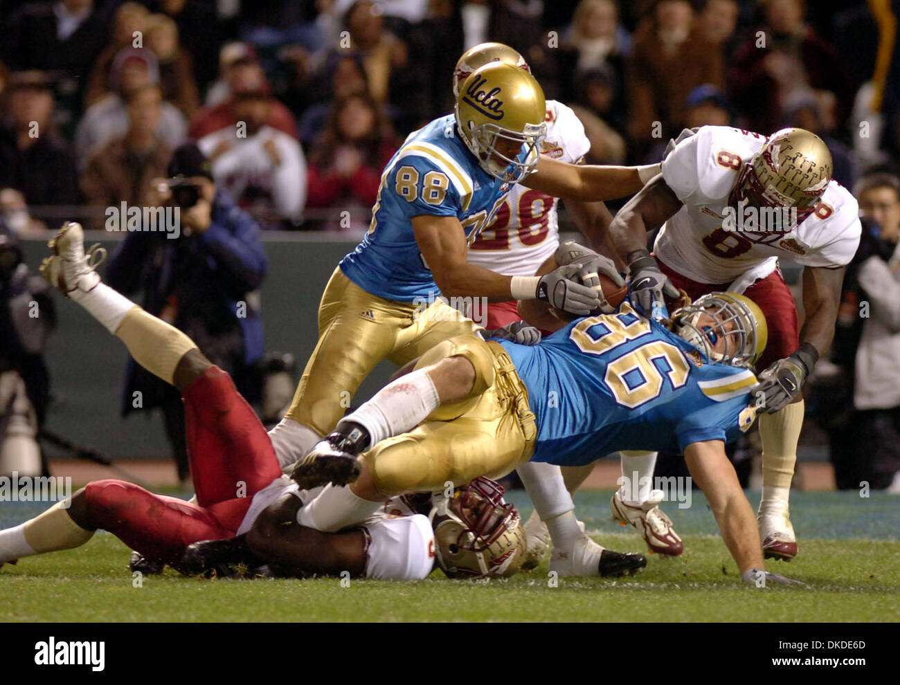 Dec 27, 2006; San Francisco, CA, USA; #86 LOGAN PAULSEN Of UCLA leans for second quarter yardage against #3 MYRON ROLLE and #8 ROGER WILLIAMS of Florida State in the Emerald Bowl on Wednesday, Dec. 27, 2006, at AT&T Park. Mandatory Credit: Photo by Karl Mondon/Contra Costa Times/ZUMA Press. (©) Copyright 2006 by Contra Costa Times Stock Photo