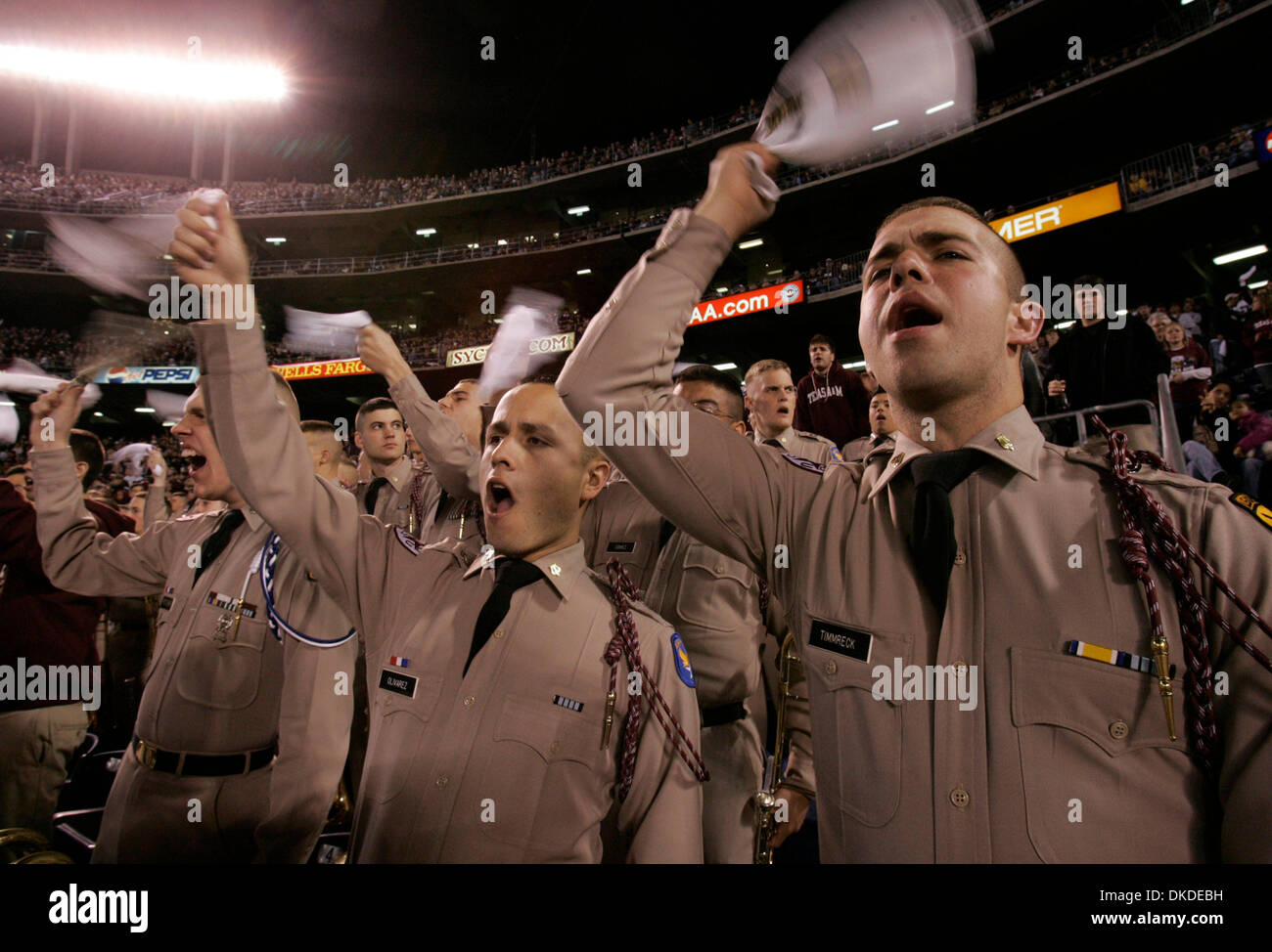 Dec 28, 2006; San Diego, CA, USA; Texas A&M cadet corpsmen MARIO OLIVAREZ  (LEFT) and STEPHEN TIMMRECK celebrate the Aggies move downfield  during the first quarter of  the Pacific Life Holiday Bowl at Qualcomm Stadium.   Mandatory Credit: Photo by Nancee E. Lewis/San Diego Union-Tribune/ZUMA Press. (©) Copyright 2006 by San Diego Union-Tribune Stock Photo