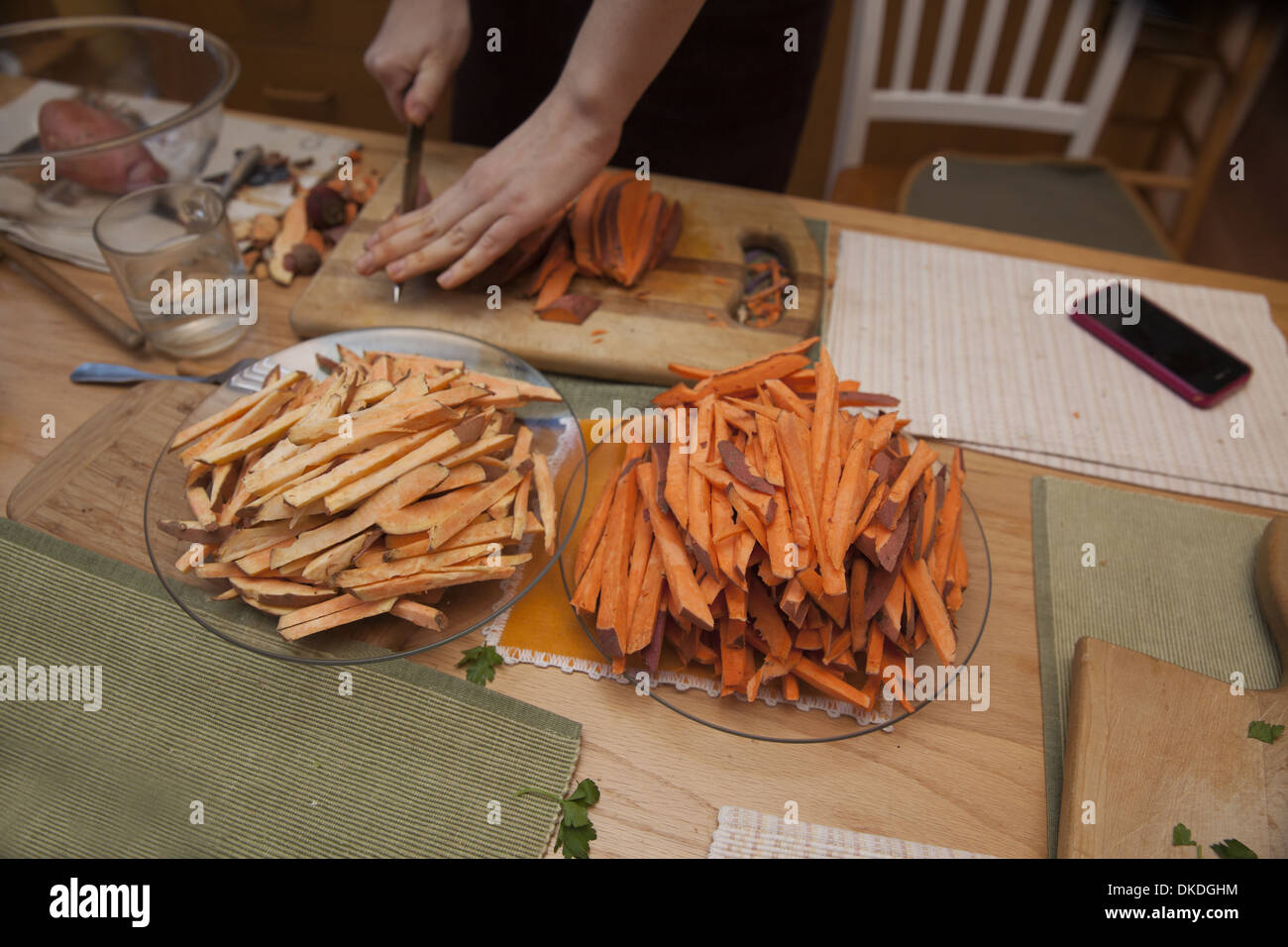 Preparing sweet potatoes and yams to make sweet potato fries Stock