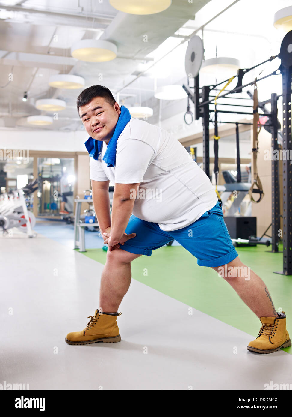 overweight man exercising Stock Photo