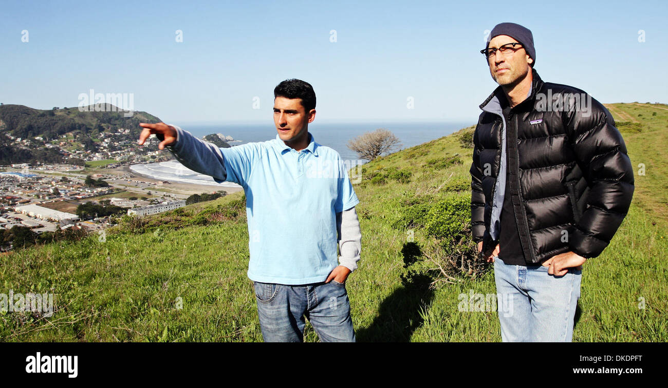 Tait Cowan(left) shows prospective buyer Robert Belli, from San Francisco,one of the lots for sale on a 68 acre site in Pacifica .Cowan and partner Stuart Newton hope to build 13 homes on the site that  will incorporate solar and wind power into their design amid a landscape of native plants and open space John Green/San Mateo County Times Stock Photo