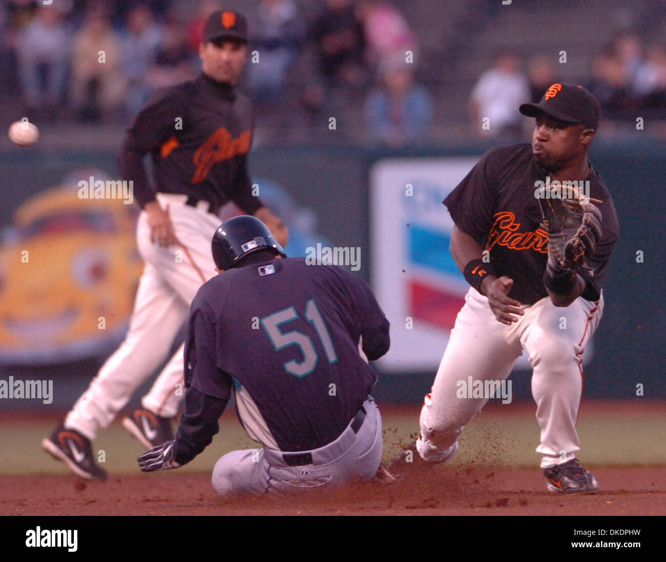 Seattle Mariners Ichiro Suzuki, #51, laughs with an umpire