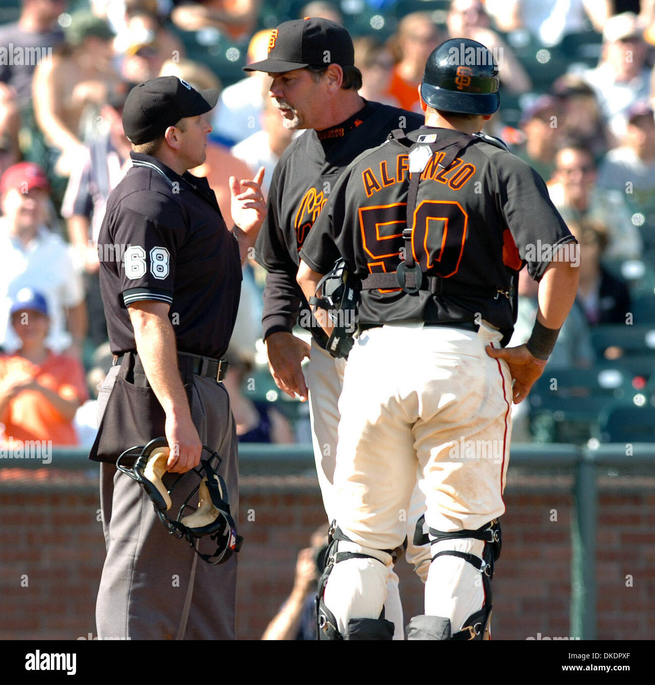 Mar 31, 2007 - San Francisco, CA, USA - San Francisco Giants catcher ELIEZER ALFONSO looks at Giants manager BRUCE BOCHY argue with home plate umpire CHRIS GUCCIONE after he called Oakland A's Lou Merloni safe at home plate increasing the A's lead to 6-4 in the ninth inning of exhibition game with the San Francisco Giants at AT&T Park on Saturday, March 31, 2007 in San Francisco, C Stock Photo