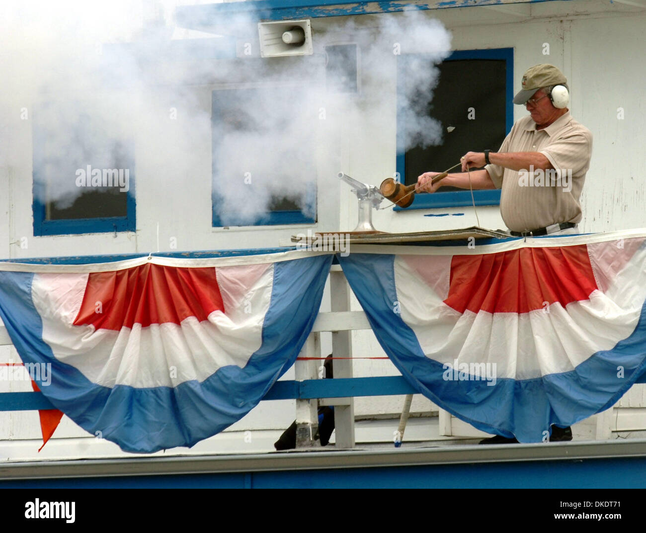 Byron Cannon fires the ceremonial cannon at the San Joaquin Yacht Club