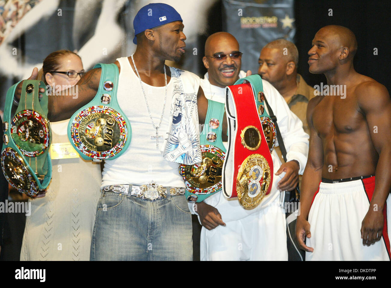 May 04, 2007 - Las Vegas, NV, USA - The World Waits: Rapper 50 CENT holds  FLOYD MAYWEATHER'S Championship belts at the weigh-in for the May 5th bout  of Floyd Mayweather against