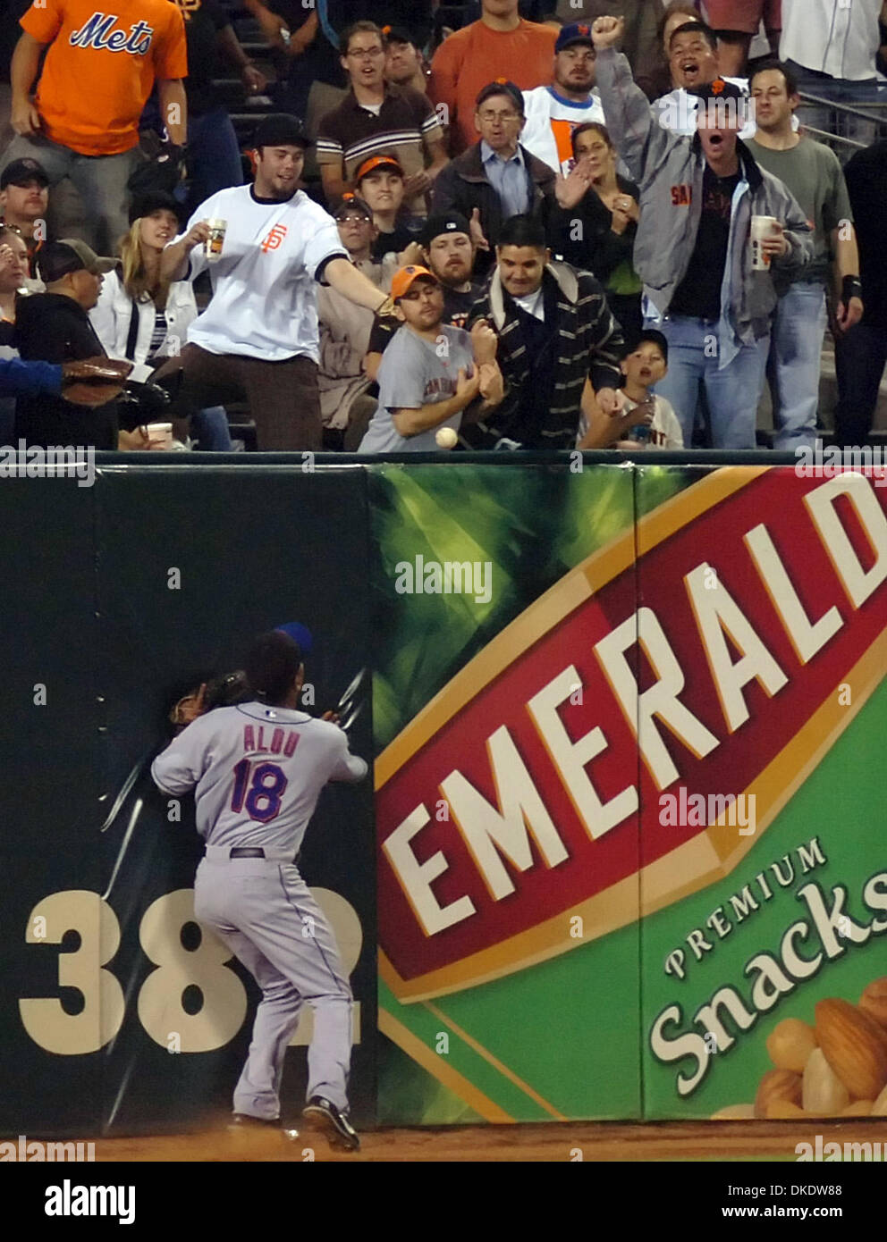 May 07, 2007 - San Francisco, CA, USA - MLB Baseball: New York Mets Moises Alou, #18, can only watch as fans reach for a ball hit by San Francisco Giants Bengie Molina, #1, in the 5th inning of their game on Monday, May 7, 2007, at AT&T Park in San Francisco, Calif. The hit would be ruled a home run which scored two runs. Later in the same inning Molina would hit a three-run home r Stock Photo